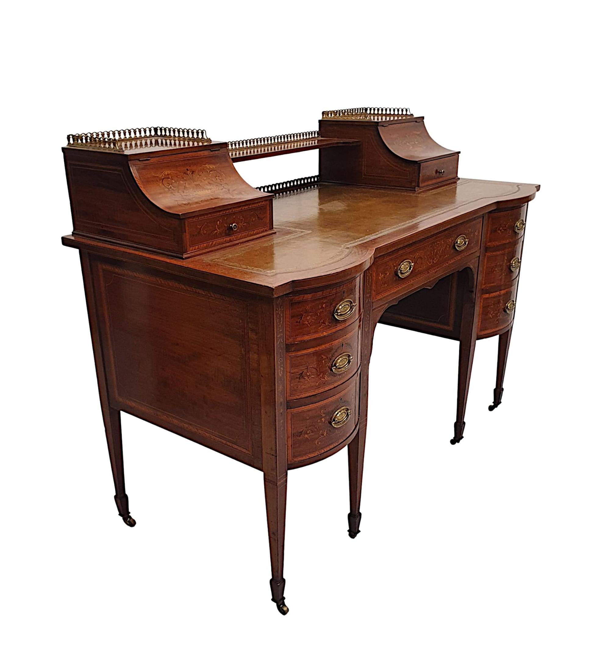 A Stunning Edwardian, richly patinated mahogany desk in the Carlton house style by Maple of London. Finely carved and of fabulous quality, line inlaid and cross banded with exquisite marquetry panel detail throughout depicting exquisite Neoclassical