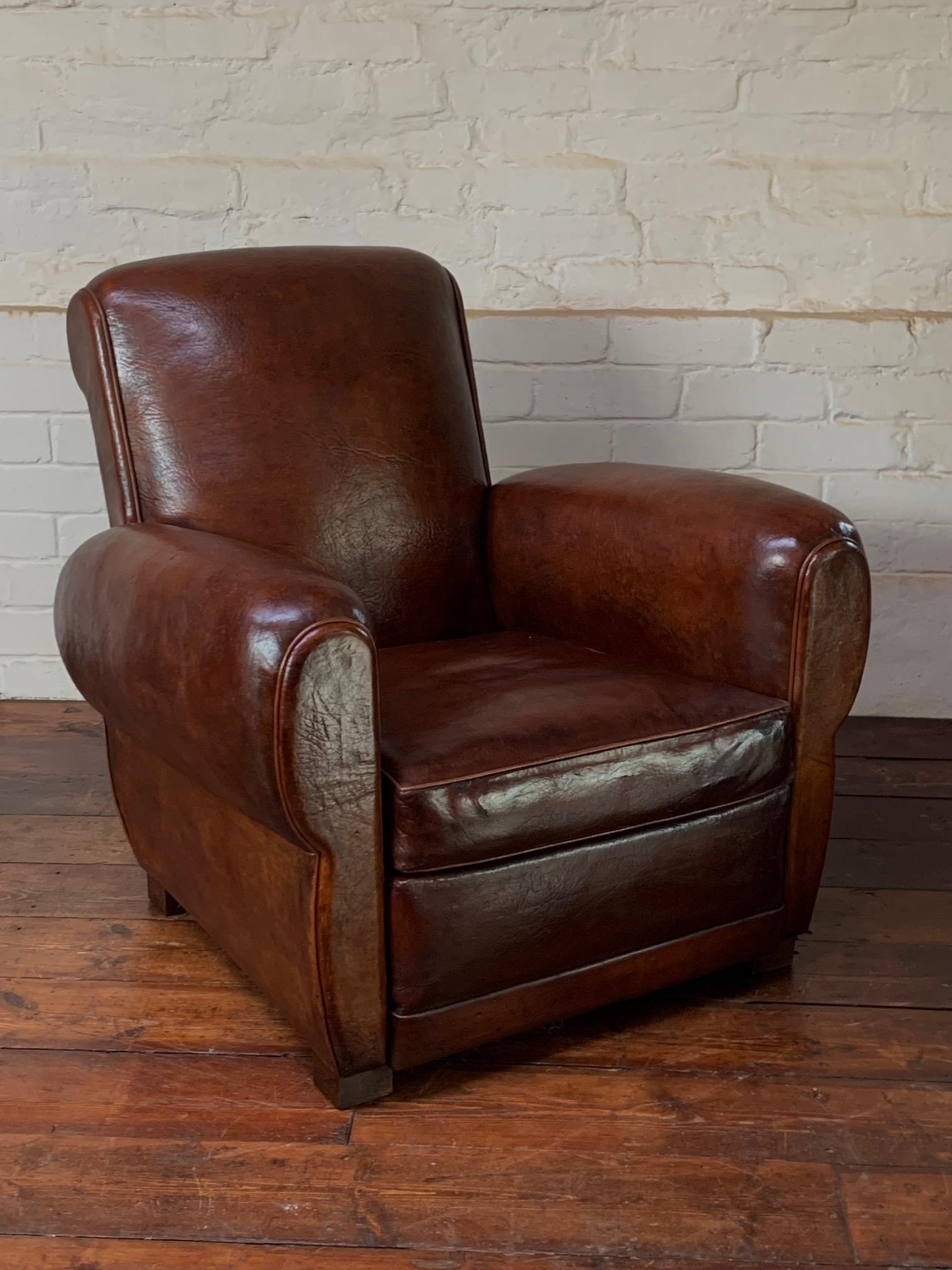 This classic original French leather club chair is a beautiful example. The thick Havana brown leather, after cleaning and nourishment has revealed a beautiful depth of colour. This chair looks great from every angle, and even the back is