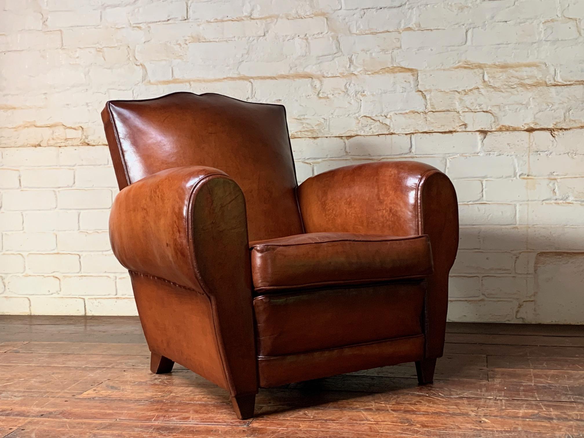 A Stunning French Leather Club Chair, Havana Moustache Model, circa 1950’s

This stunning and immaculate original leather club chair is a very lovely thing. The original Havana leather has aged beautifully through wear and lighting conditions. There