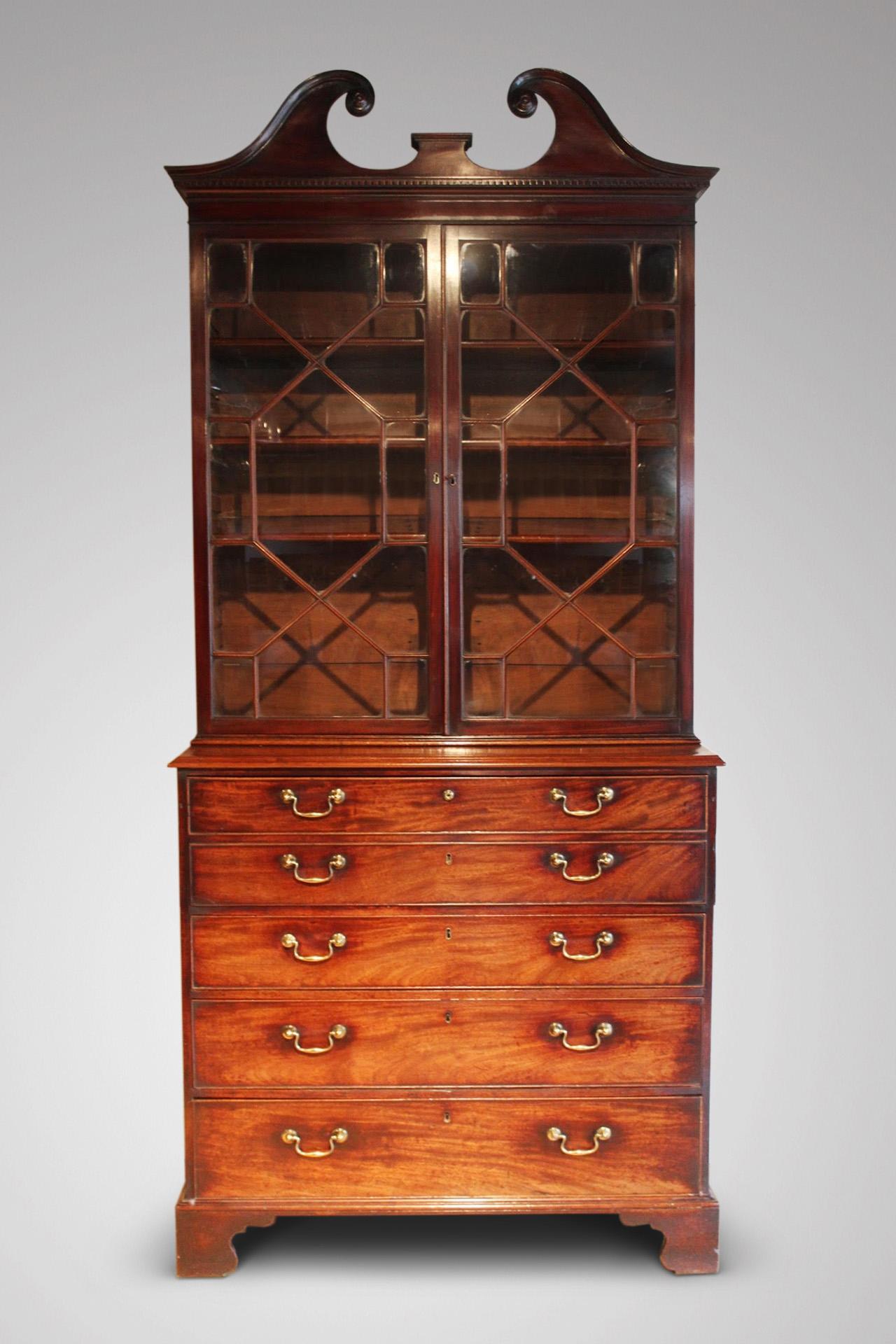 A late 18th century quality Georgian period mahogany secretaire bookcase retaining the original patina. Moulded pediment cornice above a pair of astragal glazing enclosing three adjustable shelves. The flamed mahogany secretaire drawer opens to