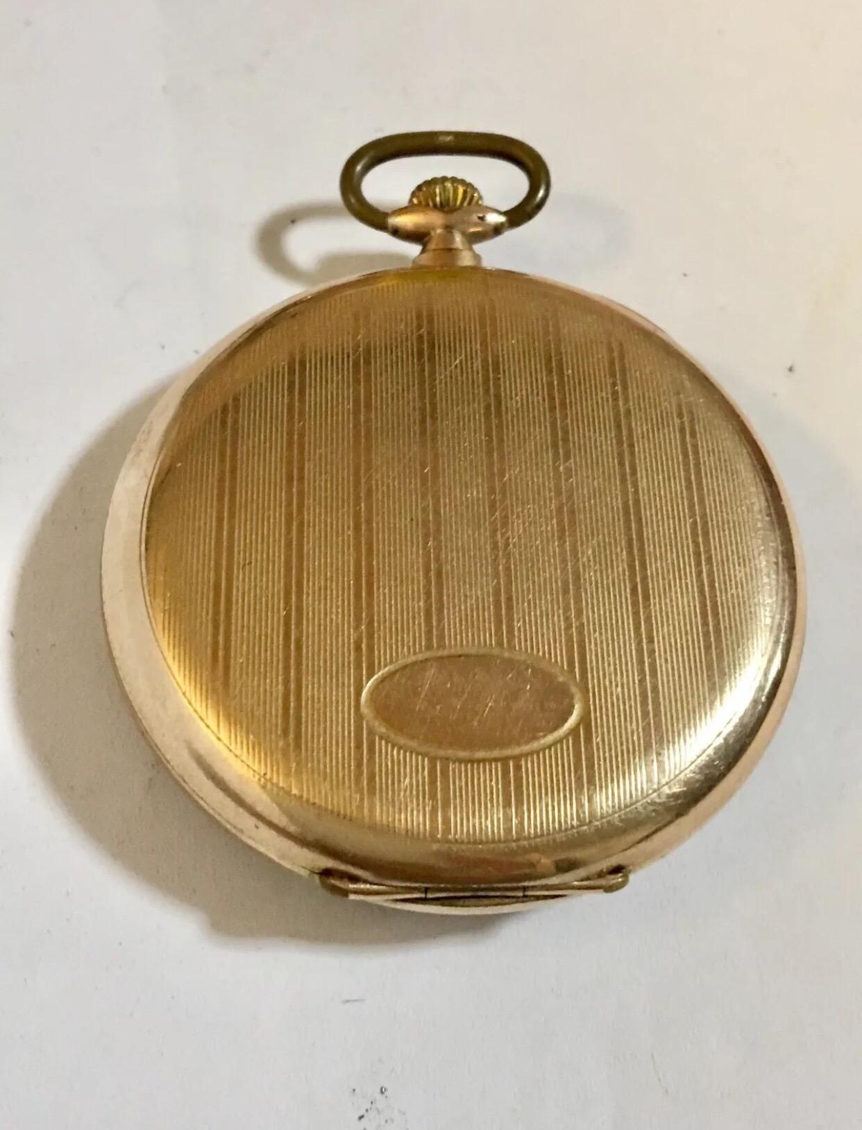 Cyma Pocket Watch . This watch in good working condition. Beautiful gold plated case. The dial looks a bit tired considering an old pocket watch. 