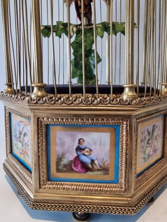 A stunning Hexagonal shaped, gilt bronze and Sevres Singing Cage by Bontems
