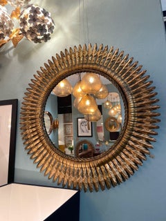 A stunning large 1950s gilt metal Spanish circular sunburst mirror