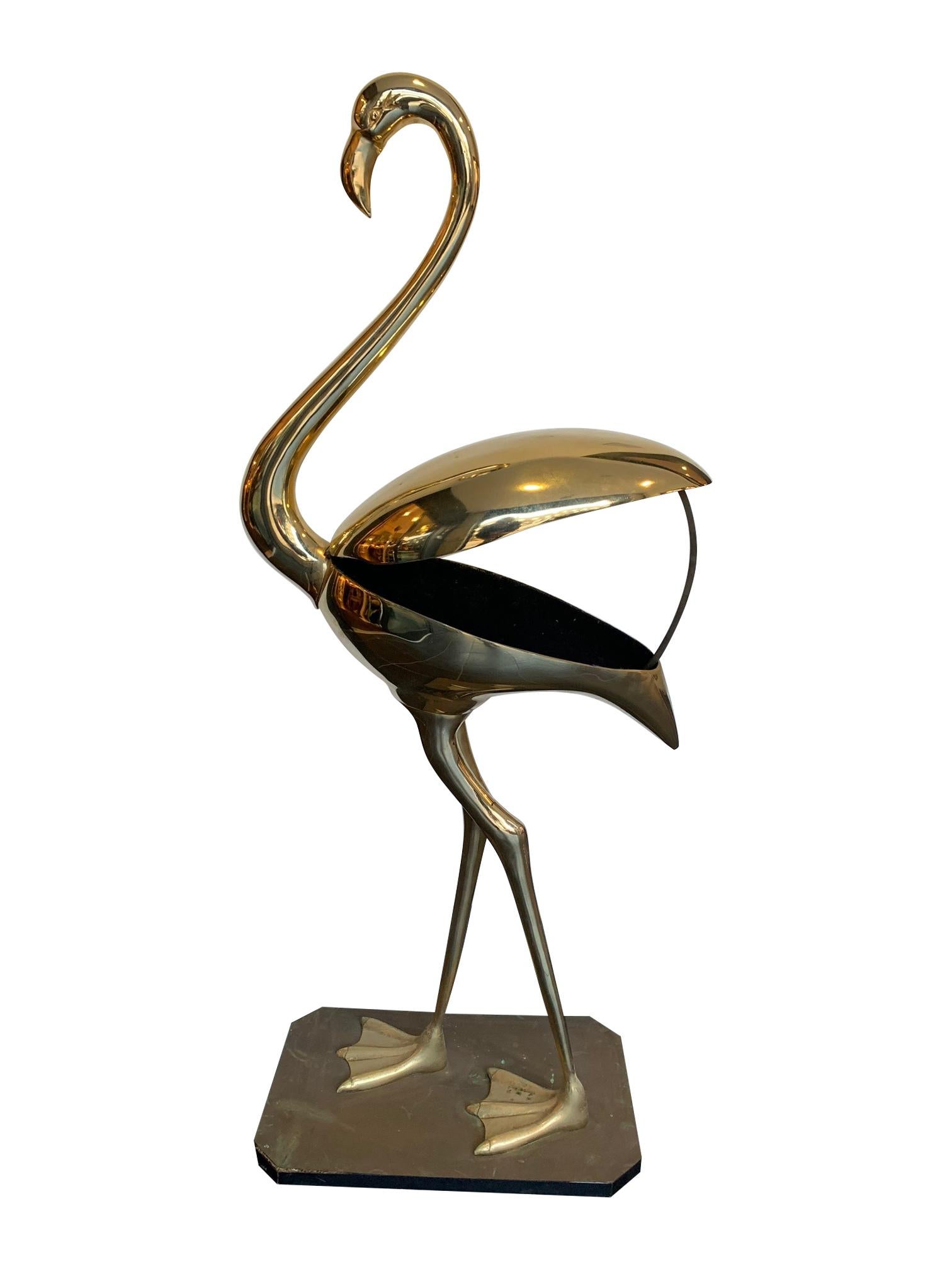 A stunning large brass Flamingo sculpture by Fondica, France with hinges back wings that opens to reveal a secret storage compartment lined with black velvet. With original metal support that holds open the lid. This was from orignal stock from a