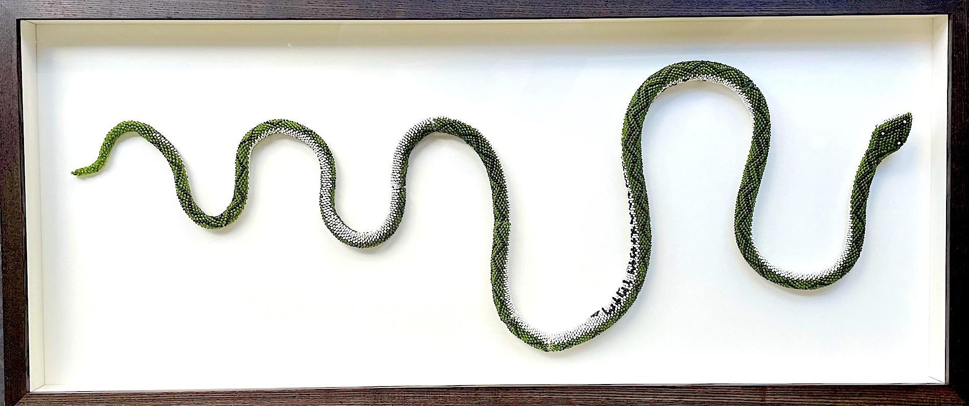 A stunning large green, white and black beaded snake with intricate zig zag snake markings along the back, made by WW1 Turkish prisoners of war with black beads spelling out 