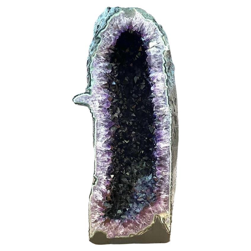 Magnificent amethyst in an agate geode from Uruguay on its wooden base,  Incredible beauty and strength.