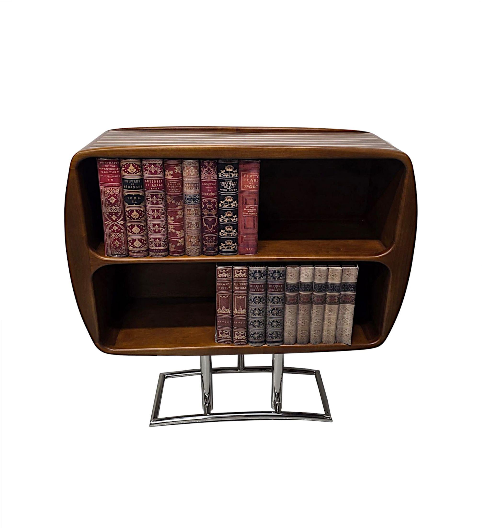A stunning mid century design richly patinated cherrywood and chrome open bookcase of exceptional quality and finely carved with a gorgeous clean simple design with fabulous chrome accents throughout.  The well figured moulded top of rectangular