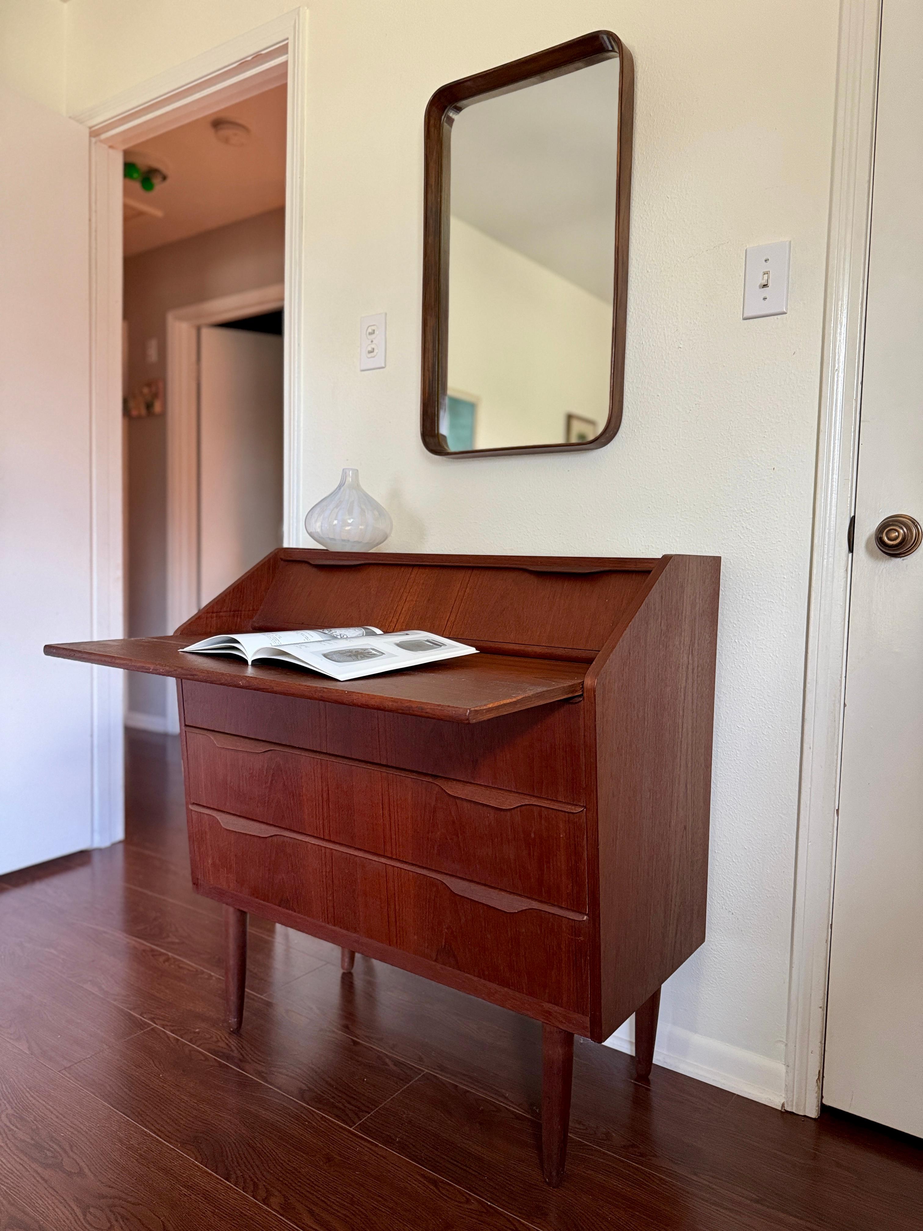 A stunning mid century modern teak secretary desk made in Denmark, circa 1960s In Good Condition For Sale In Houston, TX