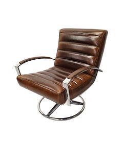 A Stunning Mid Century Style Leather and Chrome Revolving Armchair