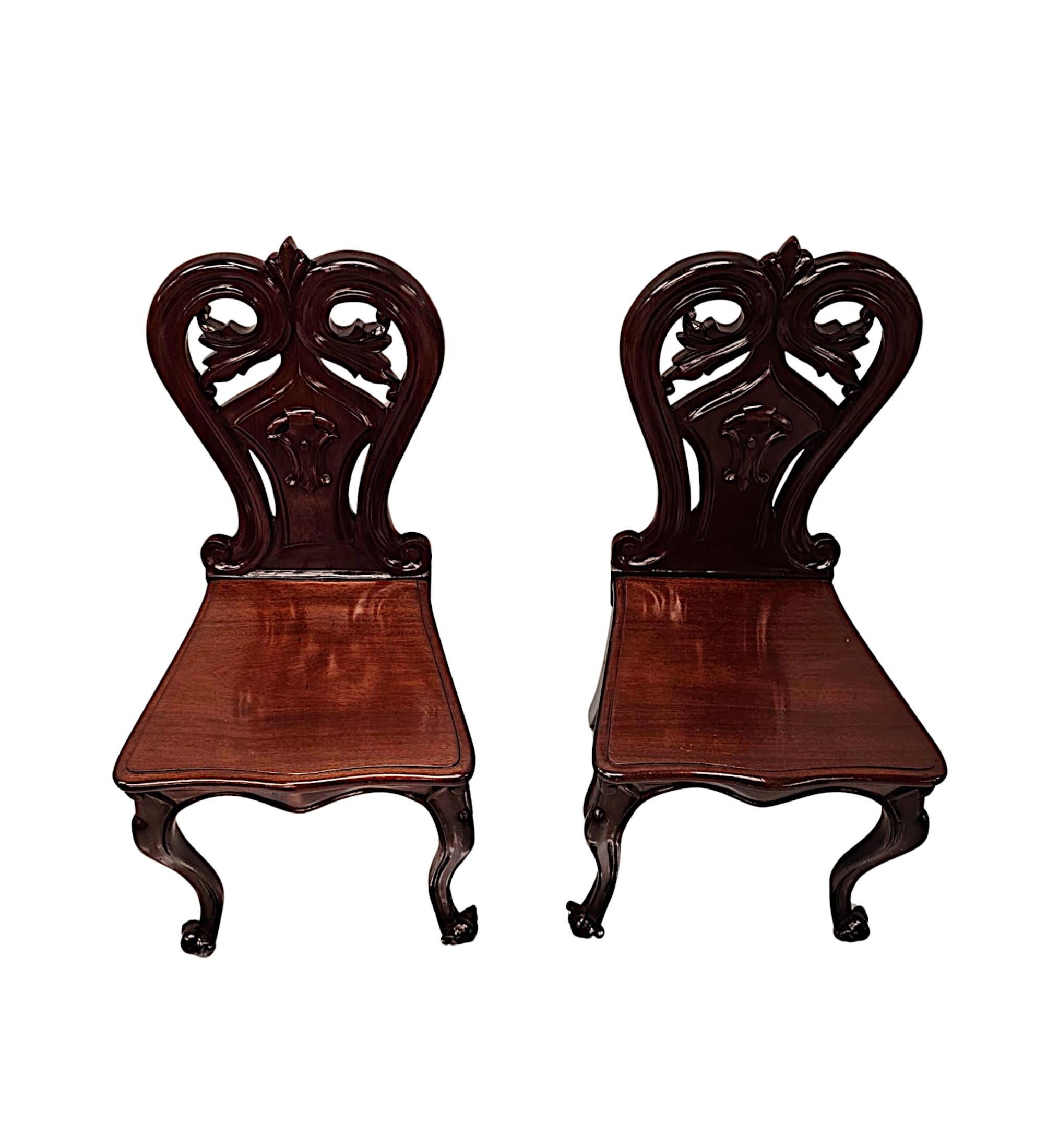 English A Stunning Pair of 19th Century Hall Chairs For Sale