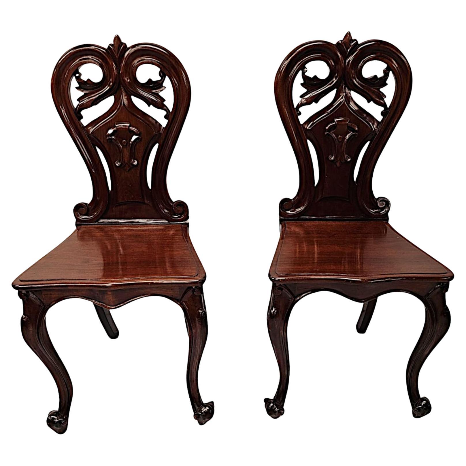A Stunning Pair of 19th Century Hall Chairs For Sale