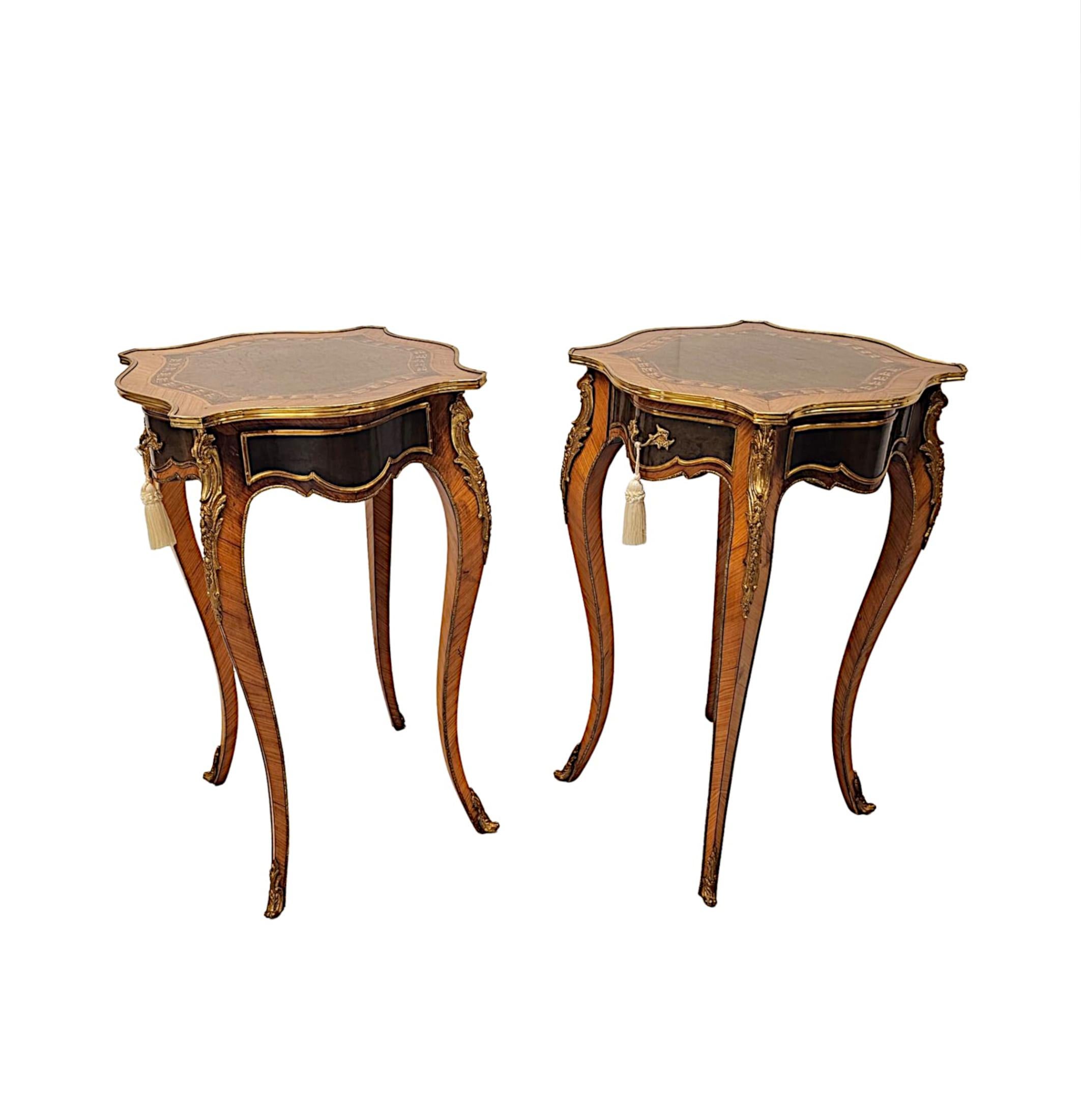 A stunning pair of 20th Century of richly patinated fruitwood side tables of exceptional quality.  This fabulous pair are finely carved with delicate line inlay, highly inlaid marquetry panel detail and finely cast ormolu mounts throughout.  The