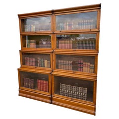 A Stunning Pair of Antique Double Waterfall Oak Globe Wernicke Bookcases