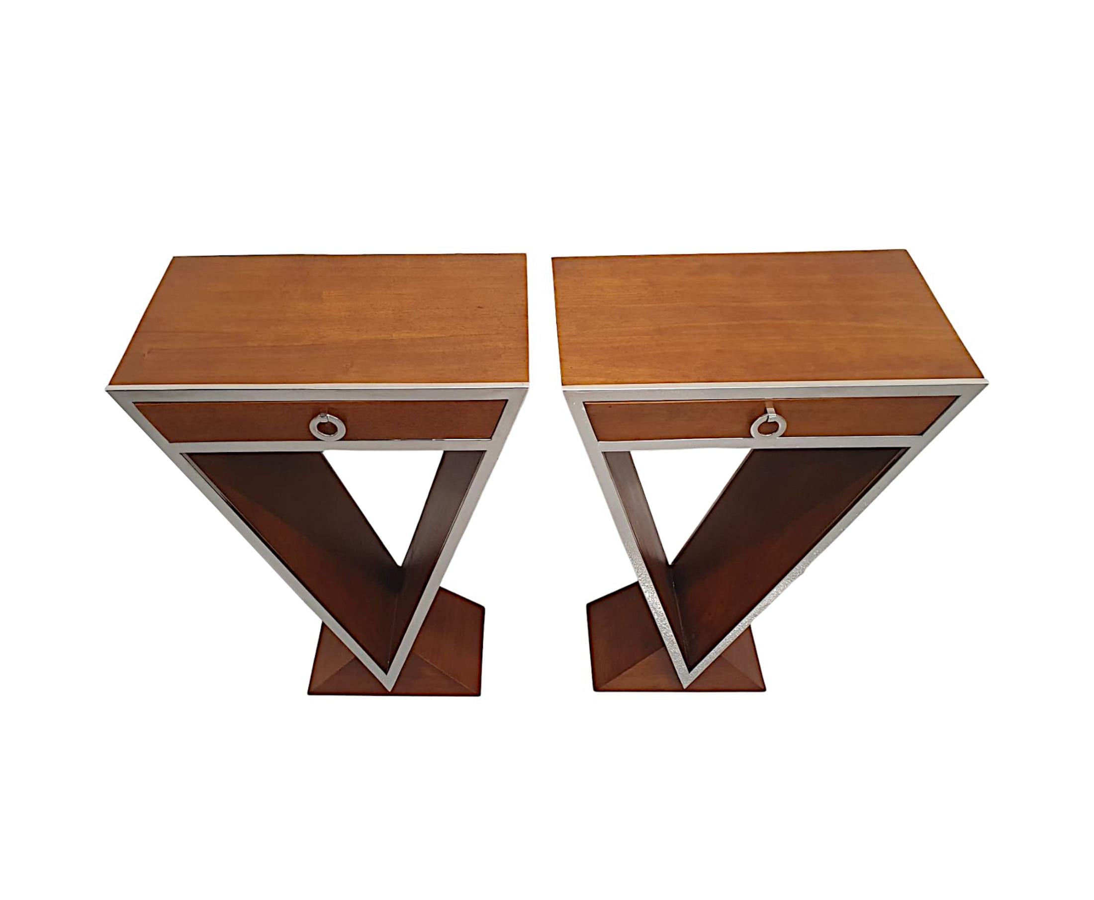 A stunning pair of contemporary cherrywood side tables in the Art Deco style of fabulous quality, clean simple design, superb patination to the wood and framed throughout with gorgeous chrome border detail.  The moulded top raised over a single