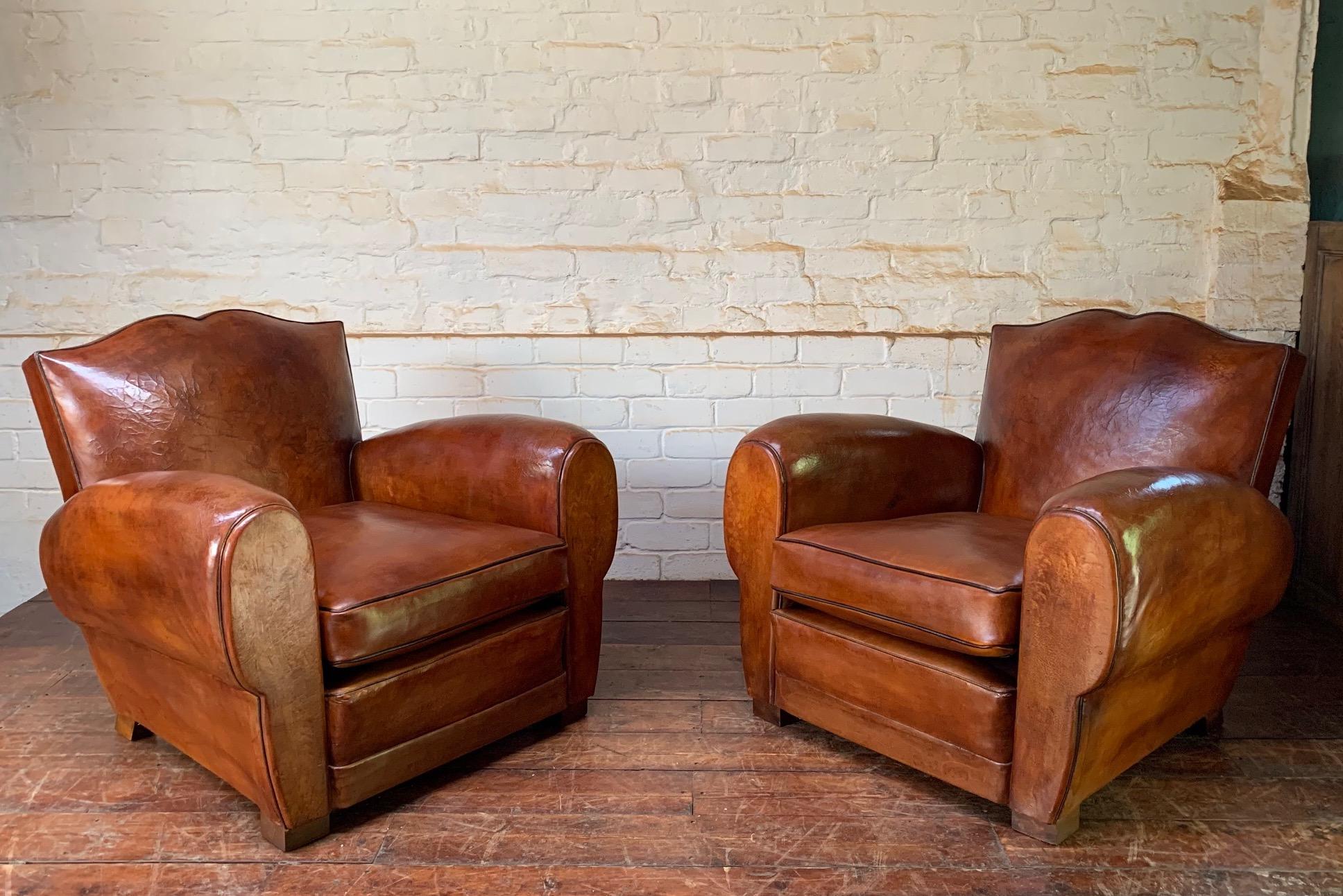 A Stunning Pair of French Leather Club Chairs, Havana Moustache Models, with Cuban Cigar Arms, C1930

This wonderful pair of early original French leather club chairs is very impressive. The leather’s colour and patina are exquisite. Probably the