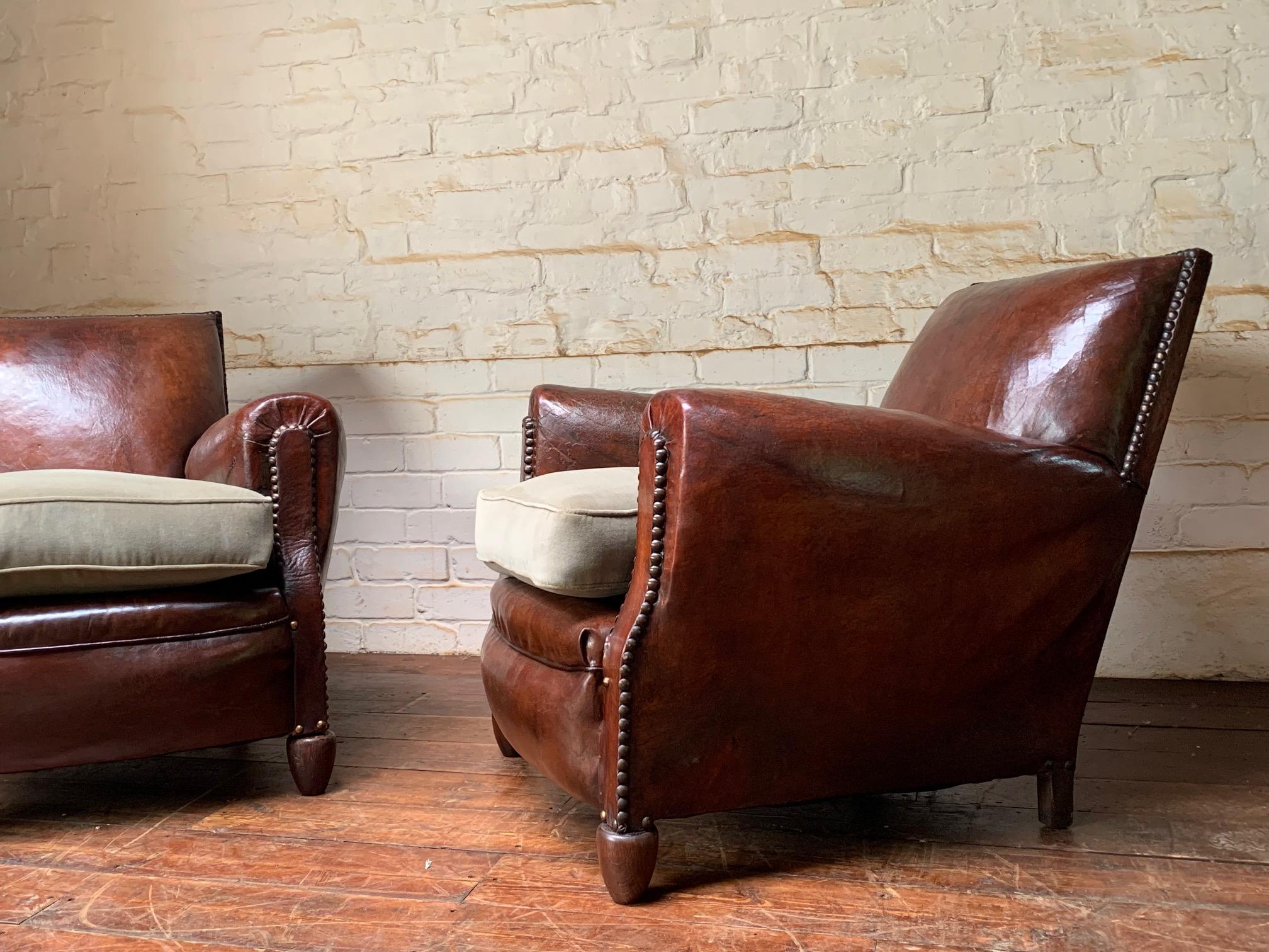 A Stunning Pair of French Leather club Chairs, Normandy Model Circa 1920’s

This are a stunning pair of early French leather club chairs. The colour is gorgeous with a rich chestnut patina. The leather is beautiful. Stylish and comfortable, these