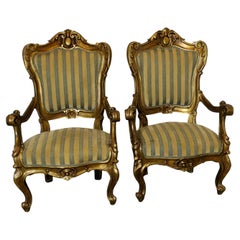 A Stunning Pair of Italian Carved Throne Arm Chairs