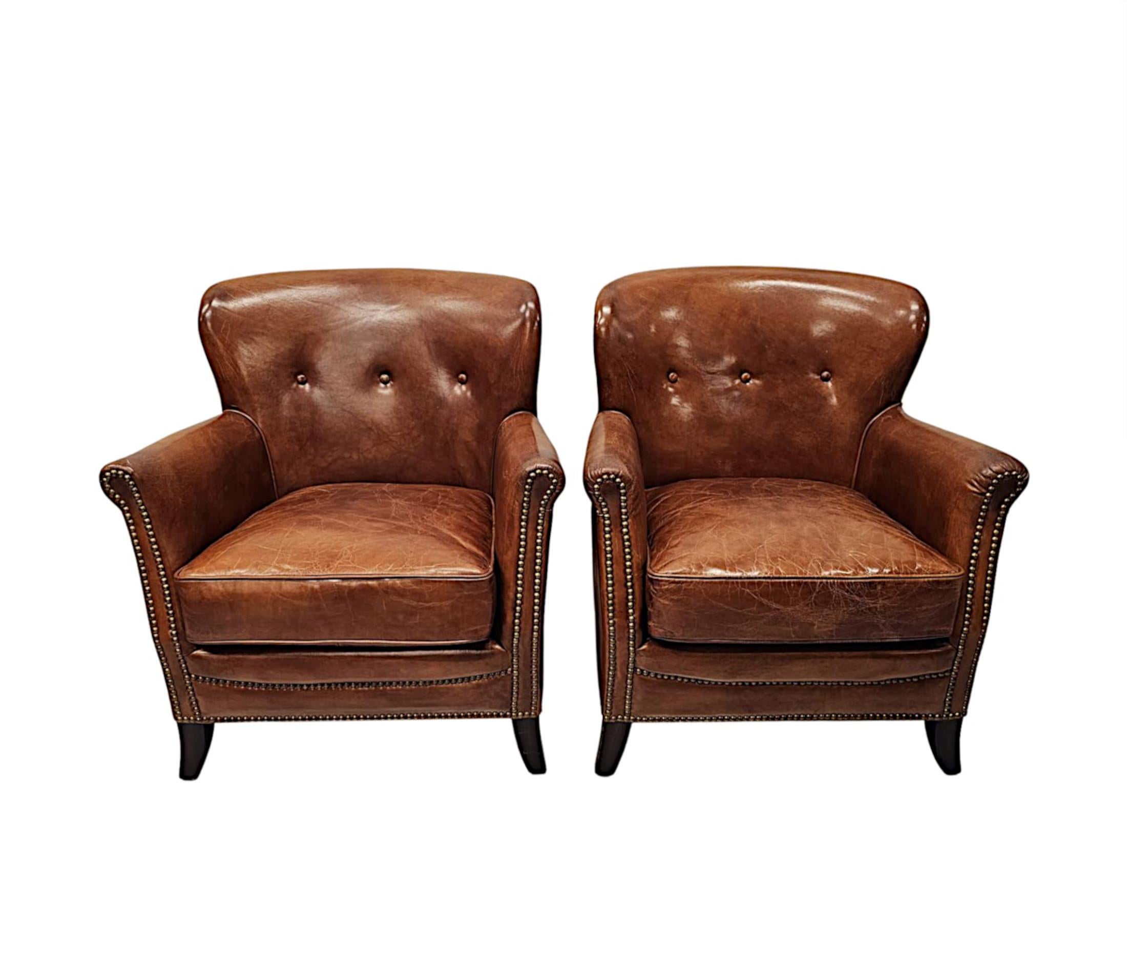 French A Stunning Pair of Small Leather Club Armchairs in the Art Deco Style