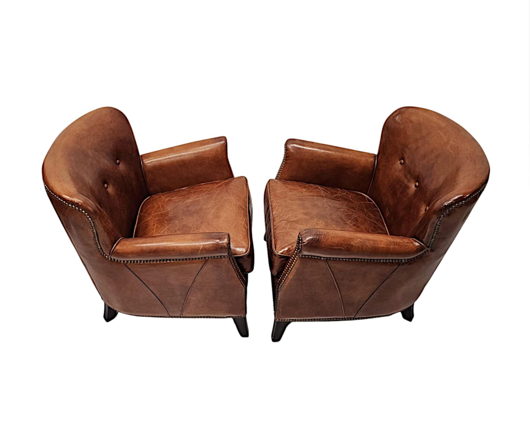 French A Stunning Pair of Small Leather Club Armchairs in the Art Deco Style 