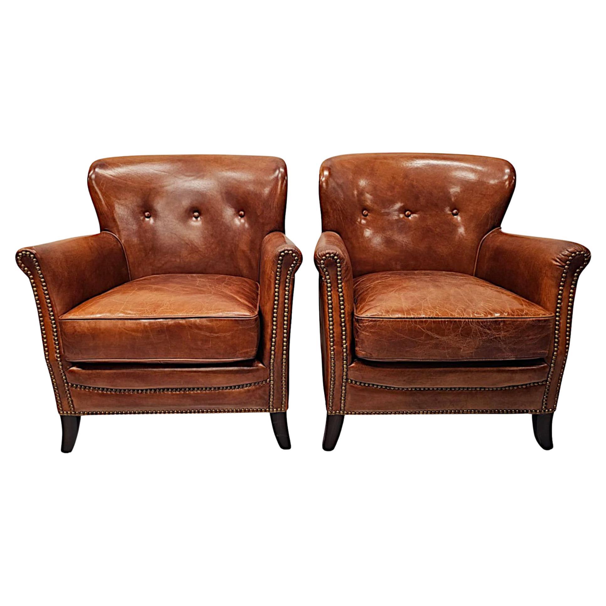 A Stunning Pair of Small Leather Club Armchairs in the Art Deco Style  For Sale