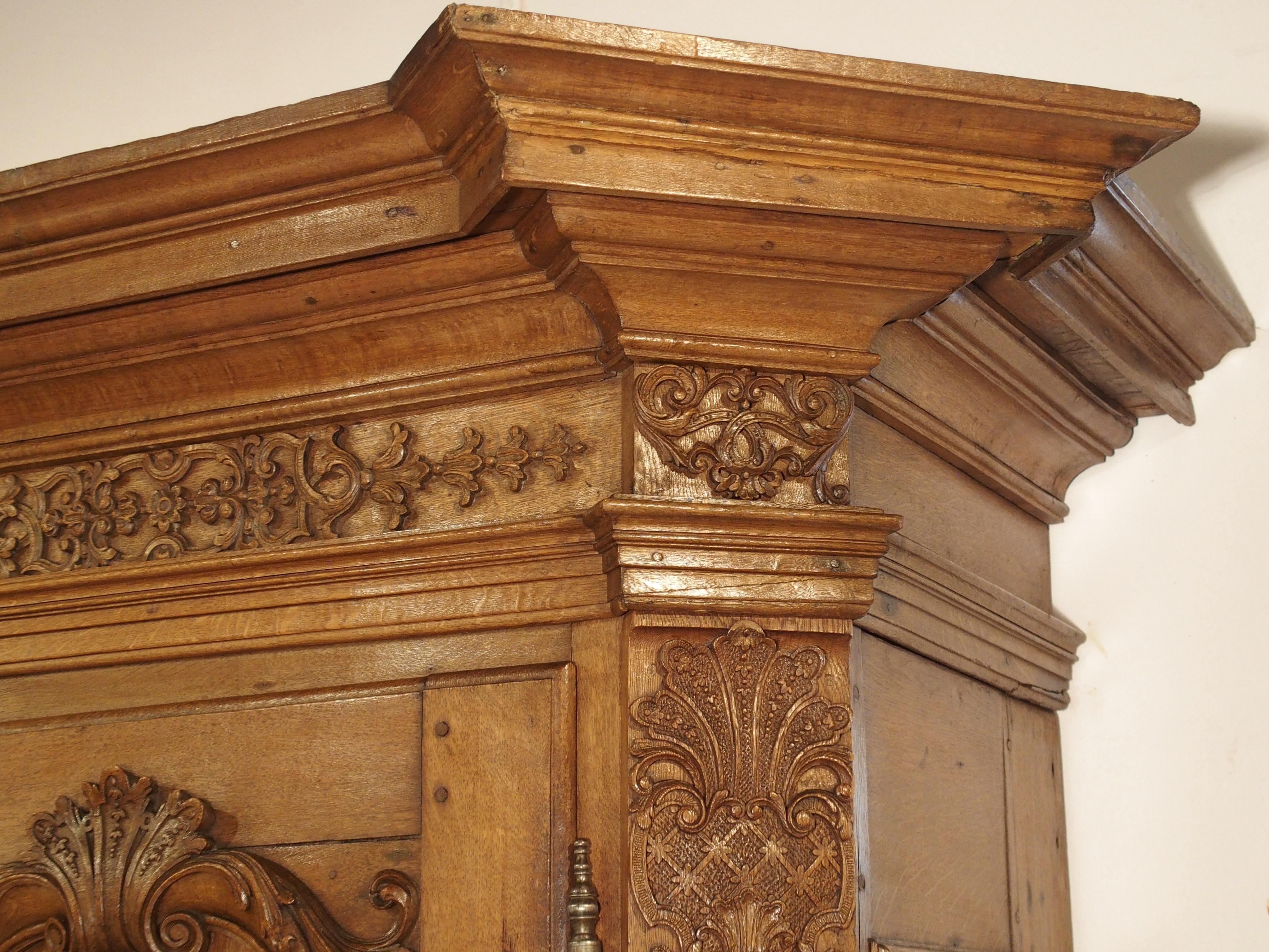 From the Regence period, this oak armoire was hand carved in France, circa 1720. Regence was the period of French history when the nation was governed by Philippe d’Orléans while the future king, Louis XV, was too young to rule. This period of