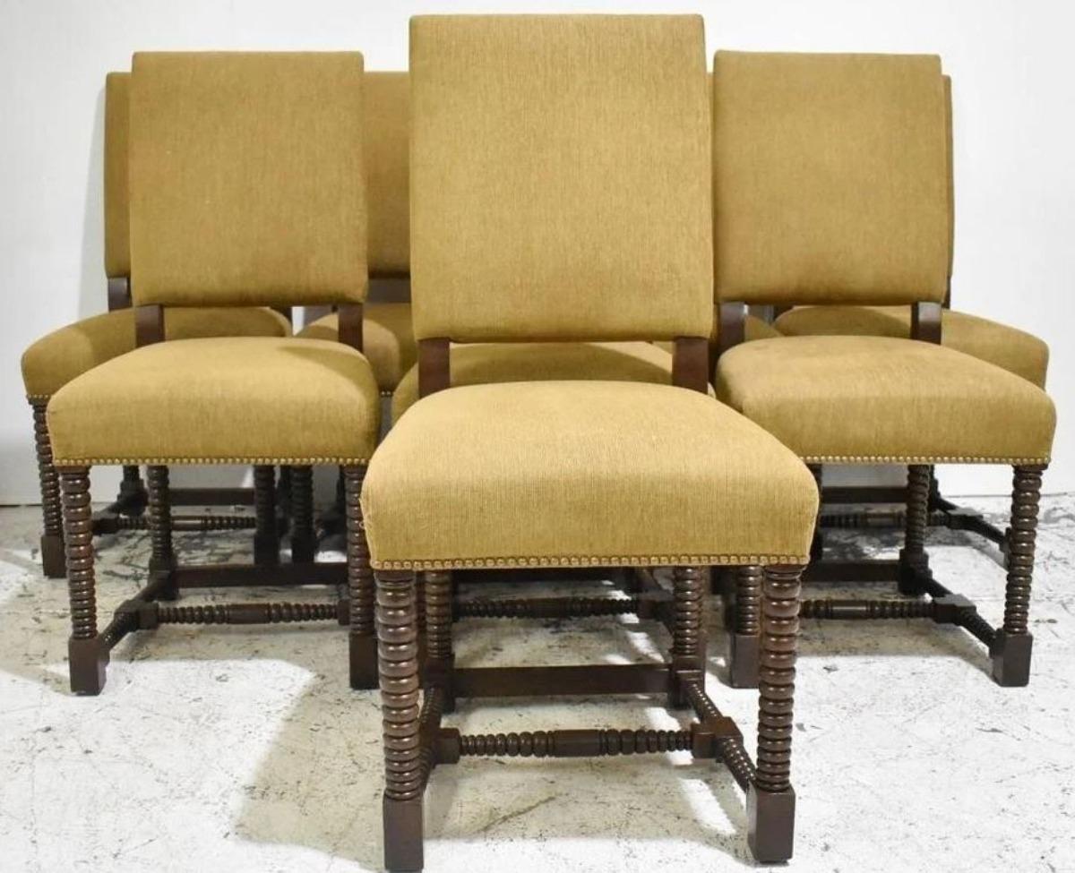 Beautiful and charming French dining Chairs set . Every section of the frame has beautifully turned solid wood elements creating the bobbin structure. The seat has been fully reconditioned and upholstered in rich color fabric and nail-head