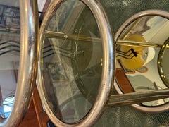 A stunning vintage 3 tiered brass and smoked glass swivel table, side table sold