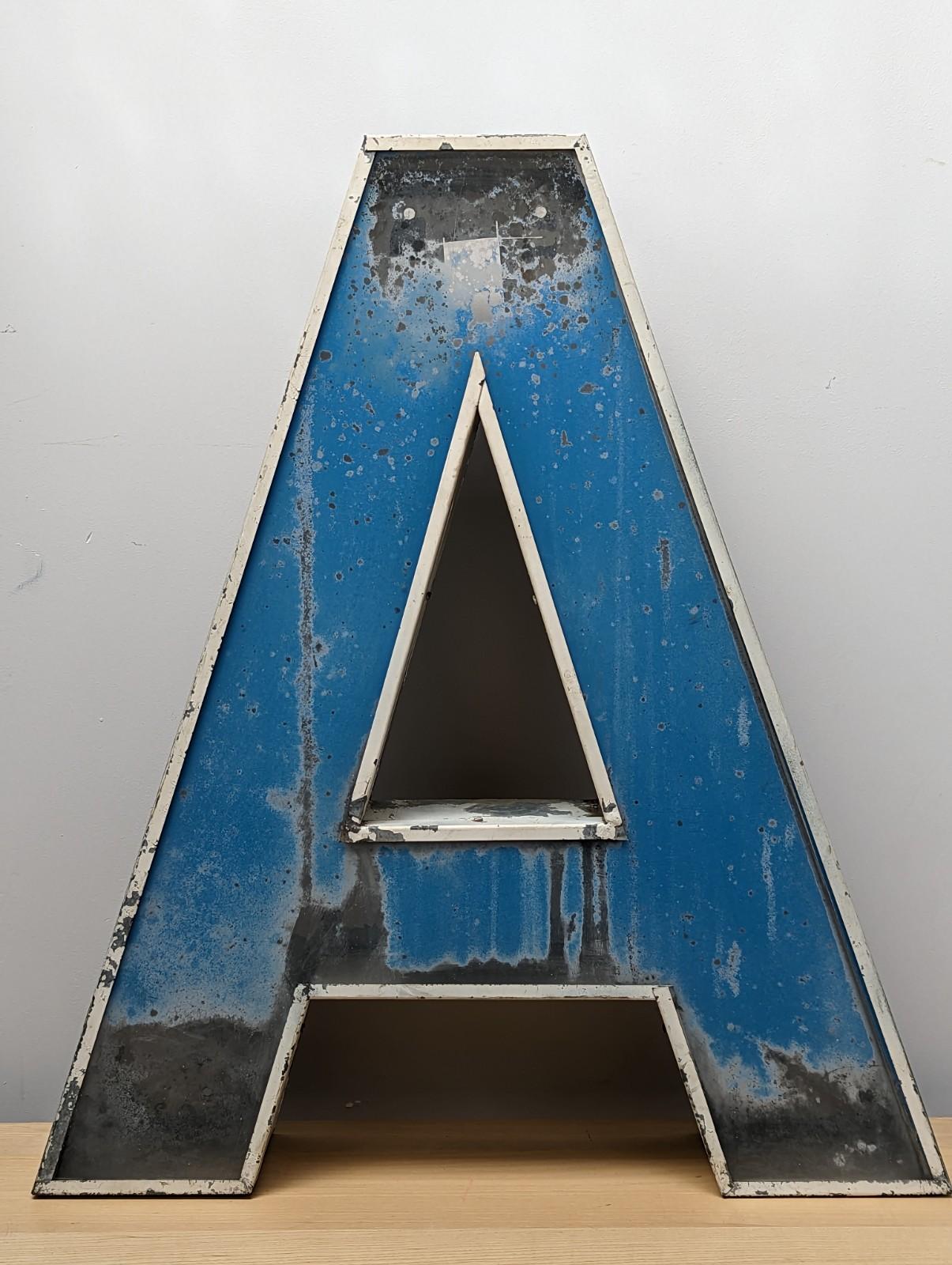 A stunning vintage metal advertising letter A.

The patina on this item is sensational.