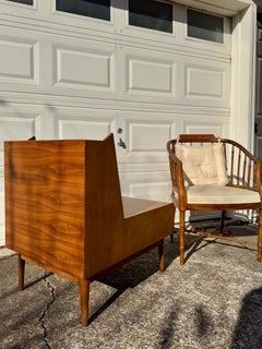 A stunning walnut night stand by Kipp Stewart for the Drexel Declaration line