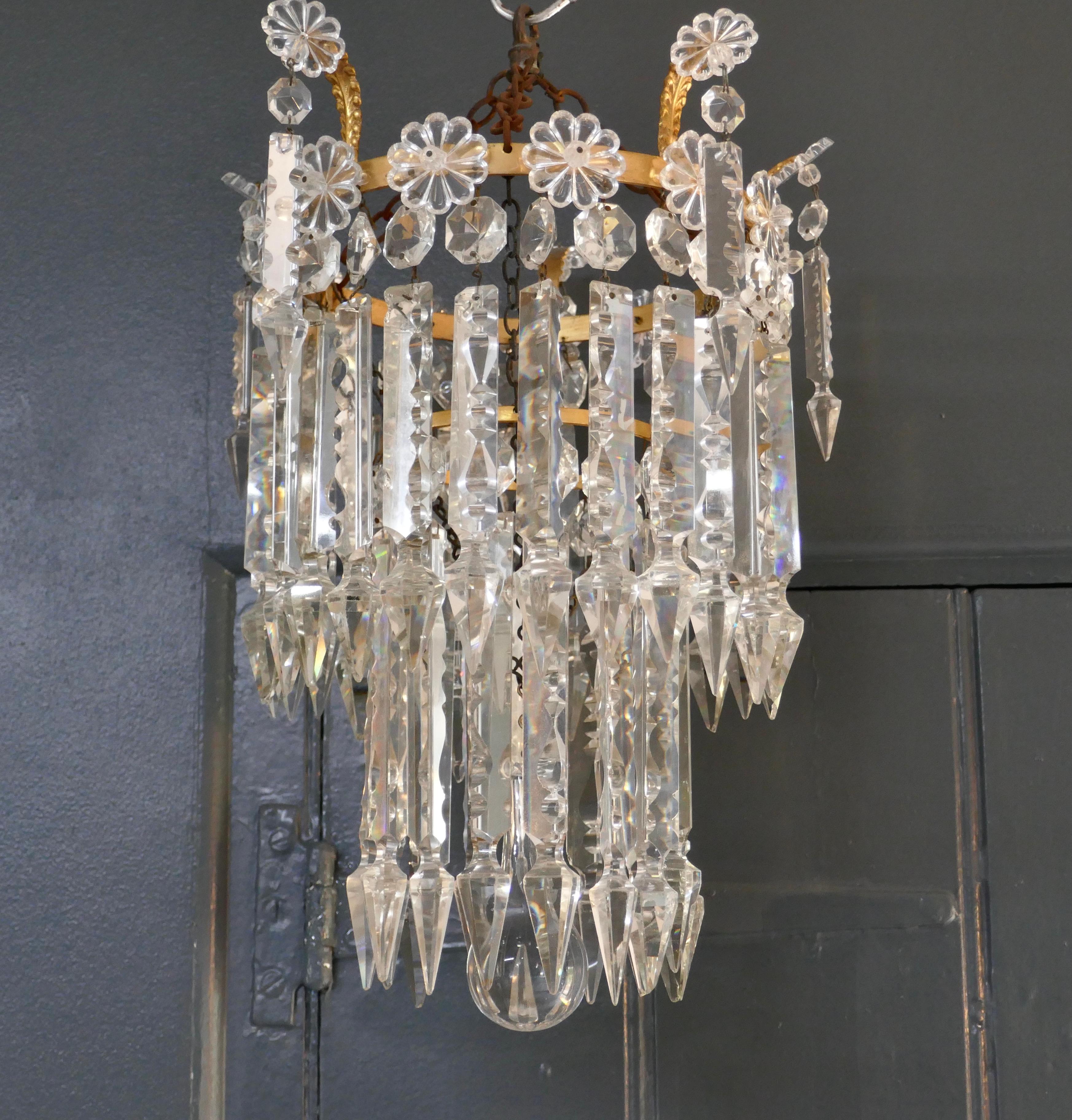 A Stunning Waterfall 2 Tier Crystal Chandelier


A Charming waterfall tiered pendant chandelier, this delicate though heavy light has 2 layers of 3 faceted cut crystal pendants hanging from a brass frame 

This Delightful Chandelier is in fact a