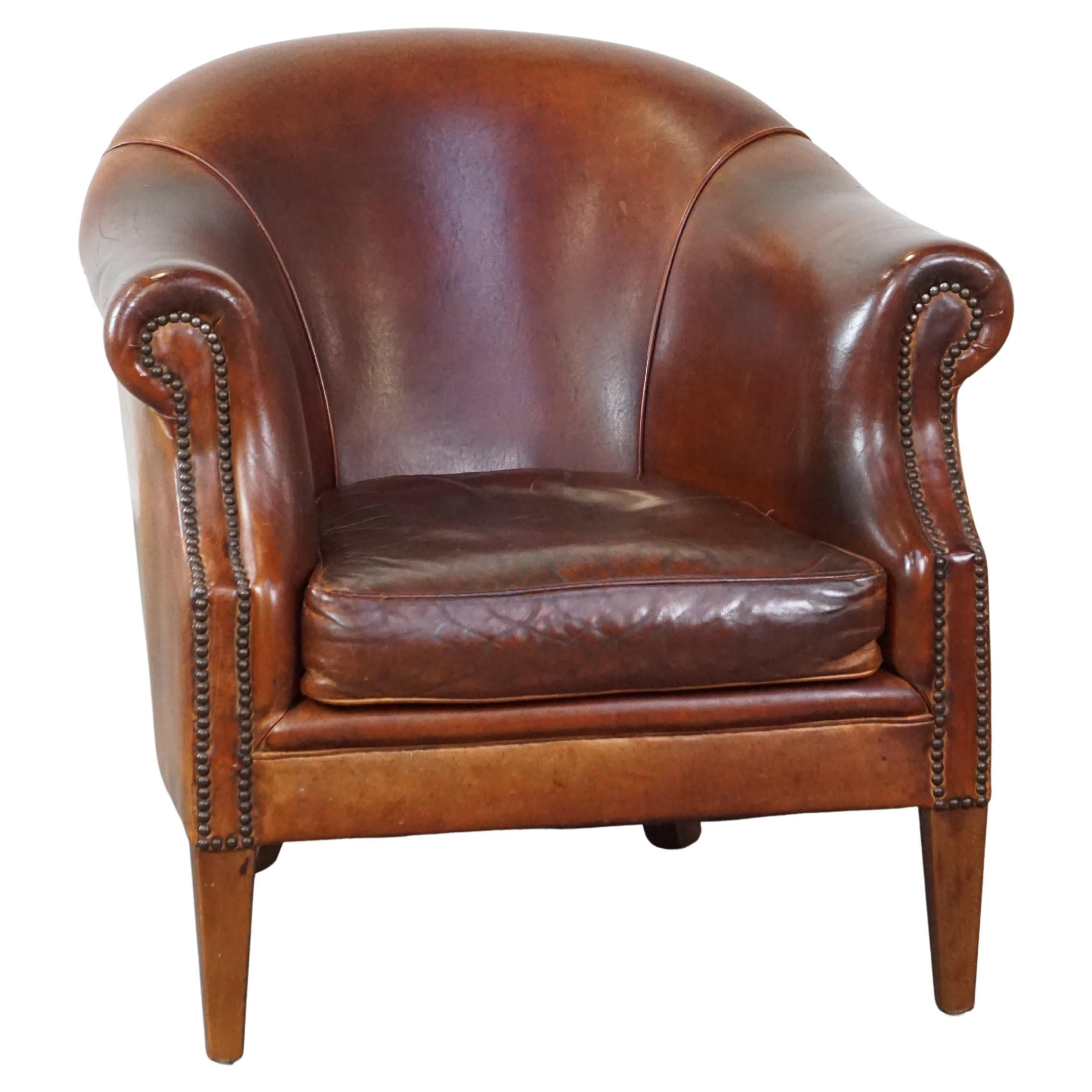 A sturdy yet comfortable club chair made of sheepskin leather