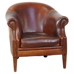 A sturdy yet comfortable club chair made of sheepskin leather
