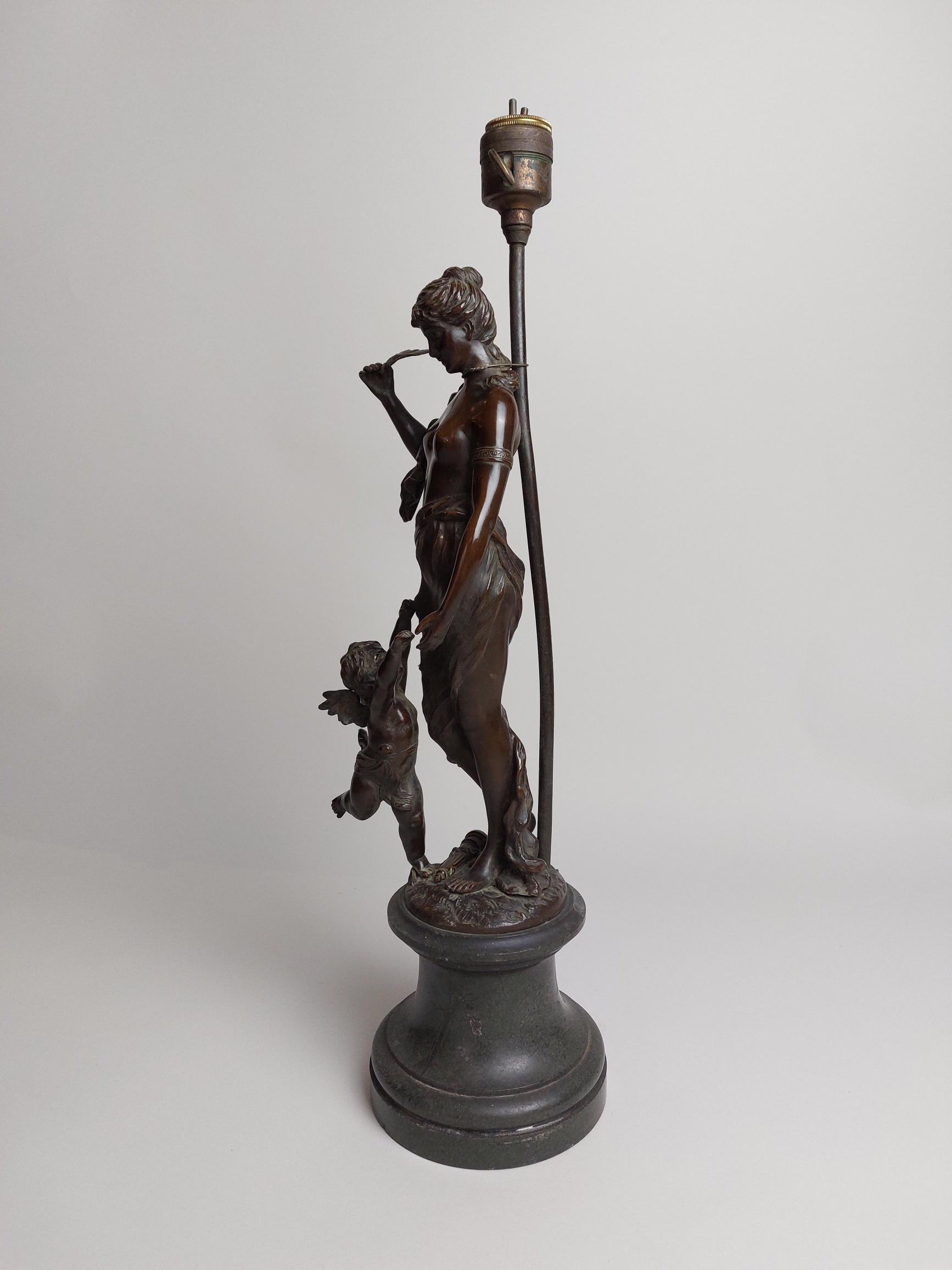 A stylish 19th century bronze lamp base in the form of a half nude lady with a winged cherub (putto) at her feet.
Please note this is sold as seen the lamp fitting does not work and will need rewiring.