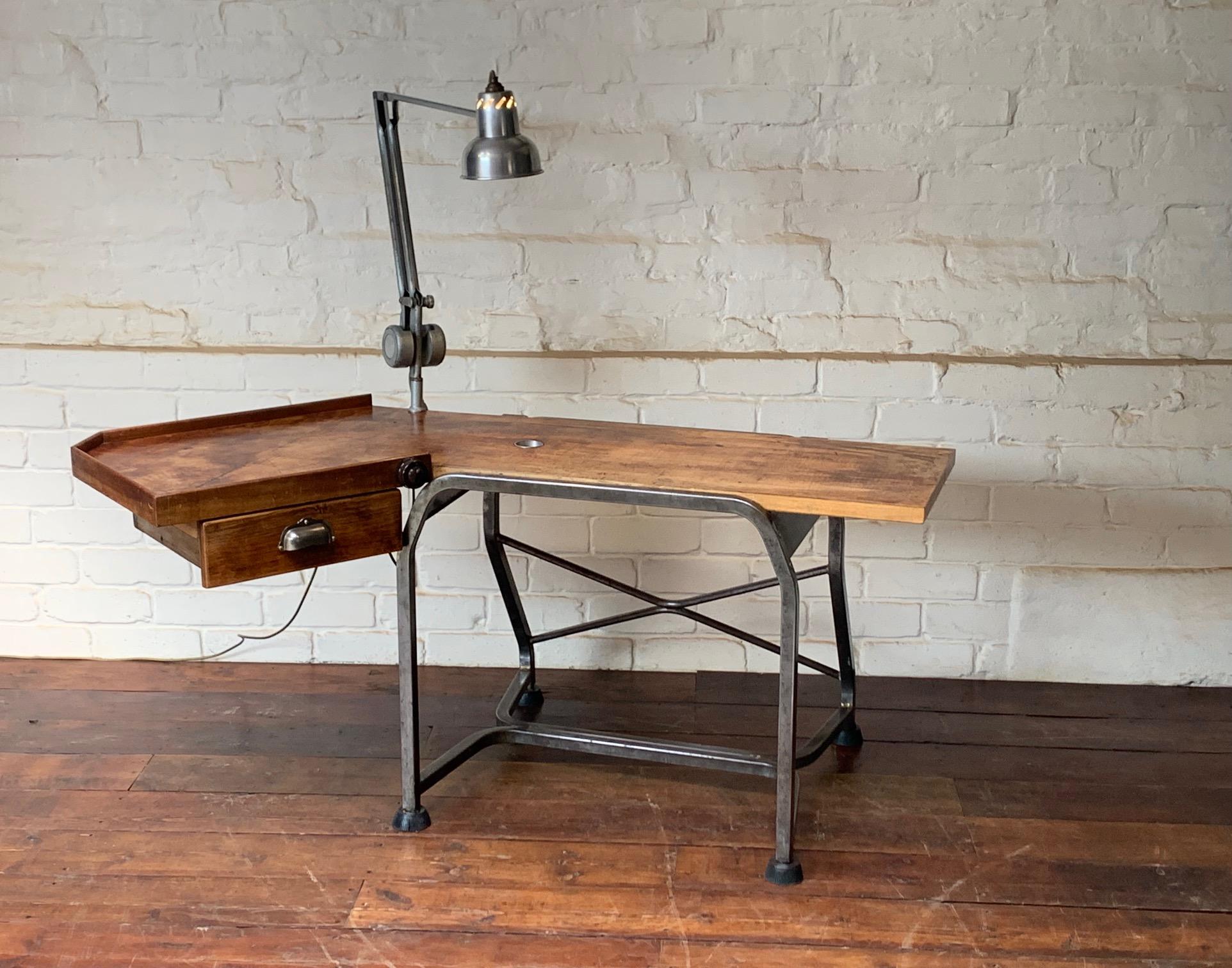 This stylish and highly functional desk was probably a one off commission, its rarity suggests so. It has a built in Bakelite switch that turns on the elegant angle poise light by Admel. The counterbalance moves smoothly around the desk wherever