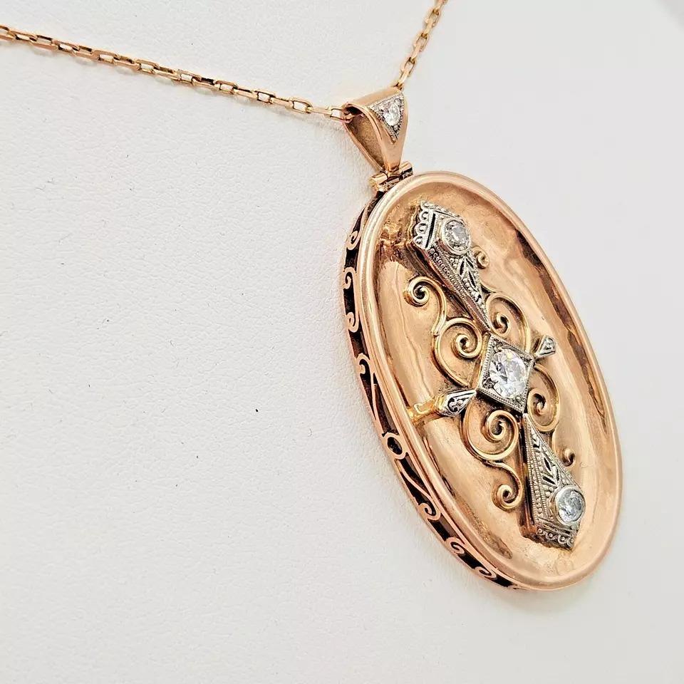 This fine and impressive vintage pendant has been hand crafted using solid 14ct gold. The entire piece was handmade in the 1920's in Germany and is ornamented with14k / 14ct solid white gold set on yellow gold, four stone old European cut diamonds,