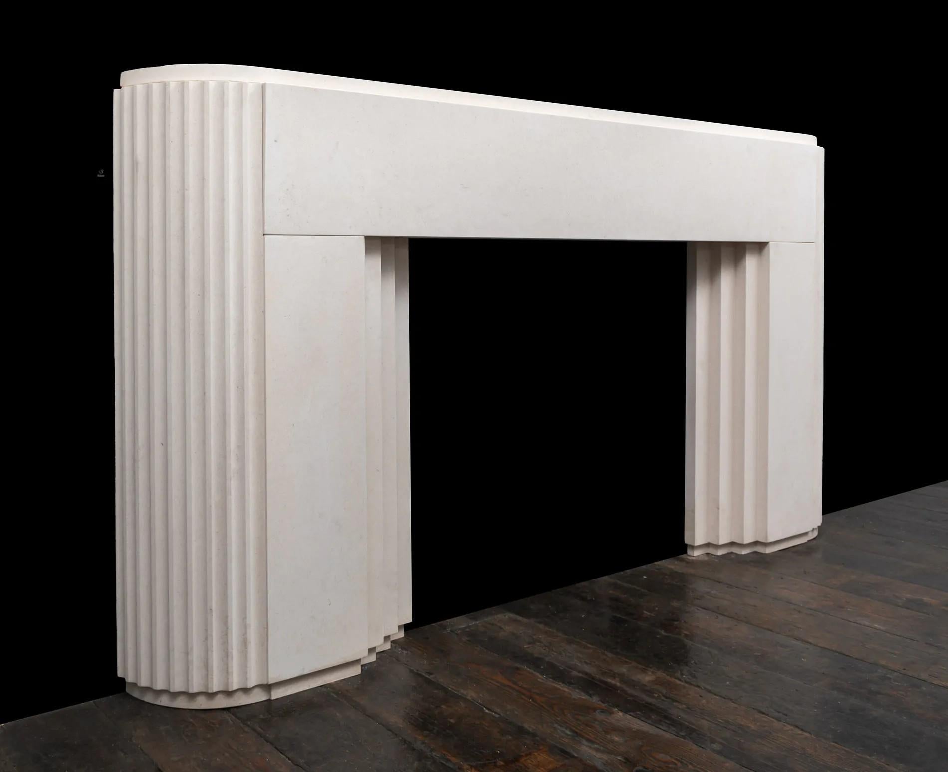 Carved A stylish ‘Art Deco’ inspired limestone fireplace mantel by 'Ryan and Smith' For Sale