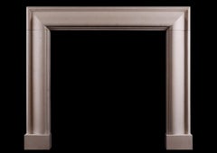 A Stylish English Moulded Bolection Fireplace in Moleanos Limestone.