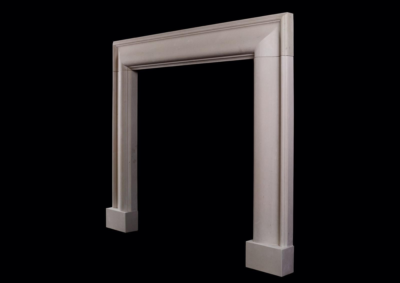A Stylish English Moulded Bolection Fireplace in Moleanos Limestone. In New Condition For Sale In London, GB