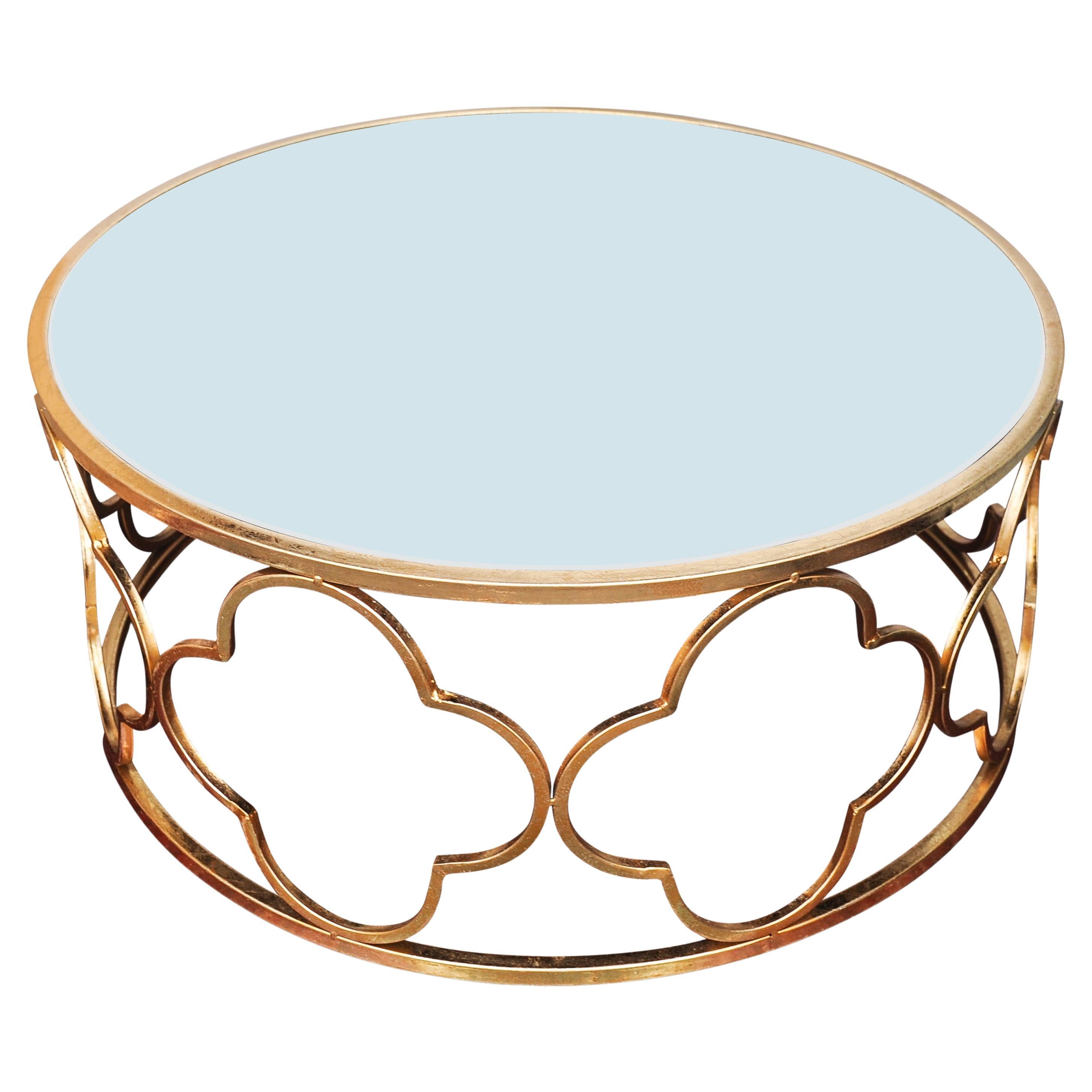 A Hollywood Regency Alhambra Design Gilt Metal & Mirrored Circular Cocktail Table 

A cocktail table with personality, for a multitude of spaces.

The motifs will create wonderful shadows in the golden hour sunlight. 