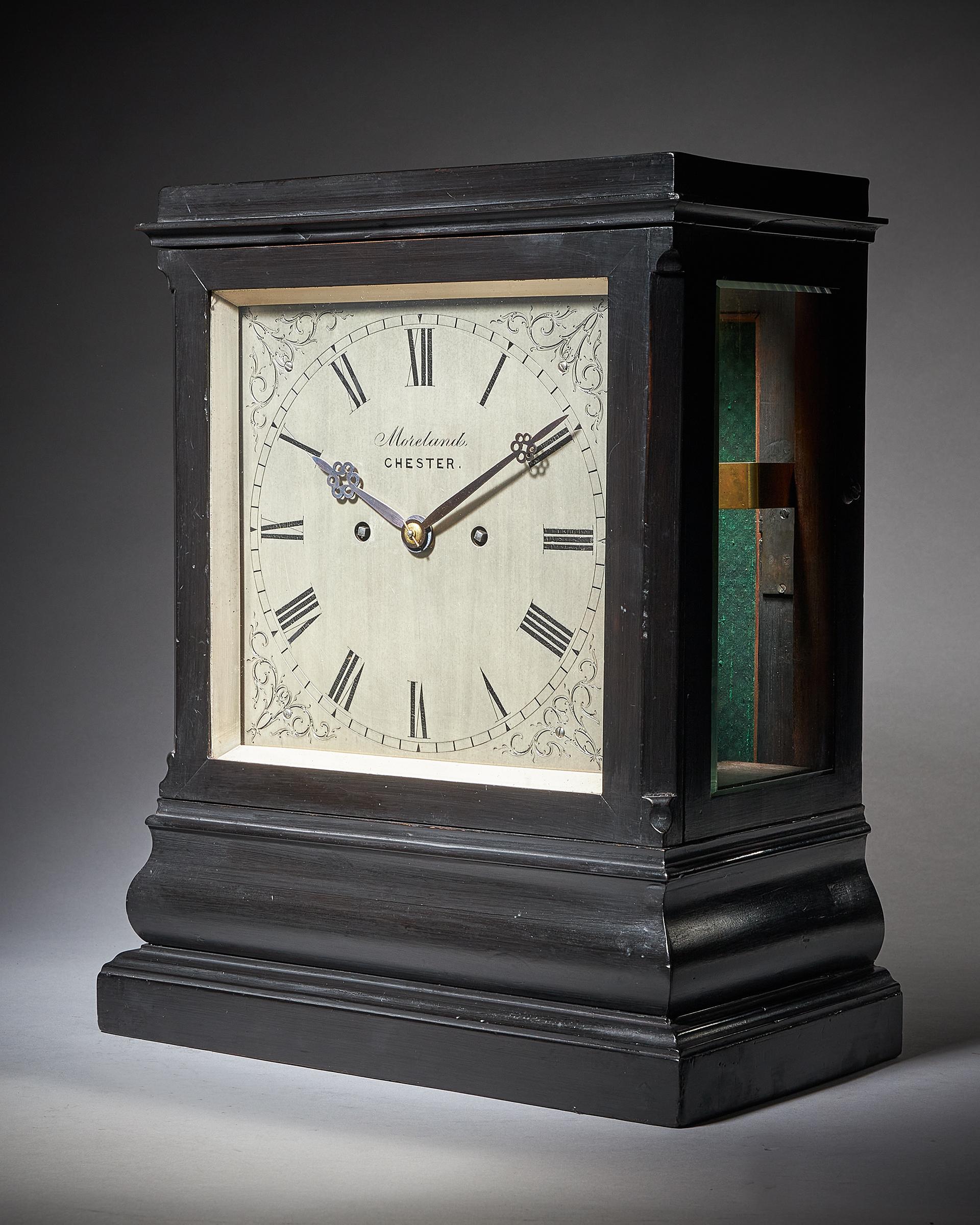 This impressive library clock has an exceptionally large six-pillar, spring-driven eight-day twin chain-fusee movement with going and striking trains with repetition. The going train has anchor escapement with a short pendulum and stirrup regulation