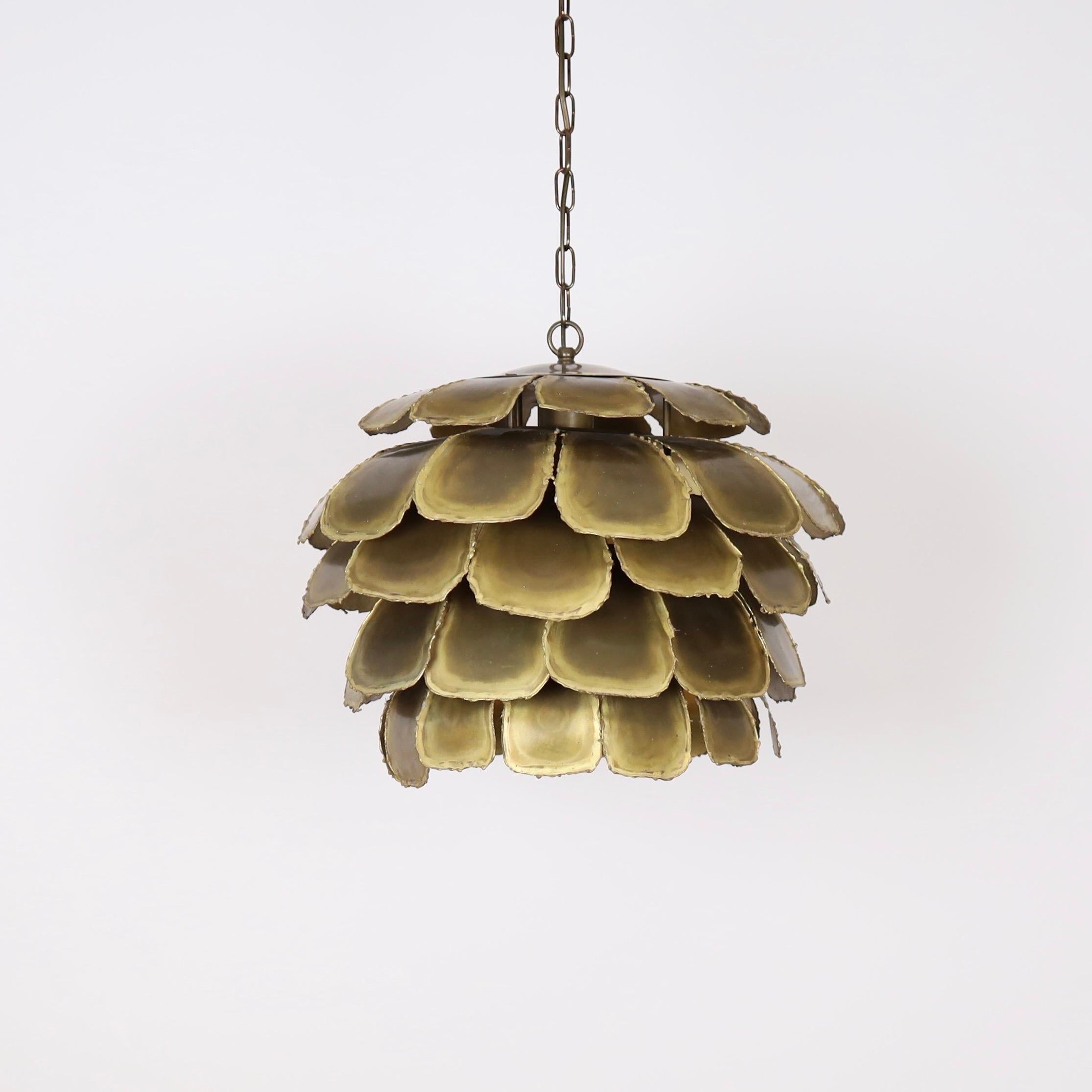 A substantial Artichoke pendant light designed Svend Aage Holm Sørensen in the 1960s. Made to impress. 

* A pendant light with layered flame-cut brass slates
* Designer: Svend Aage Holm Sørensen
* Type: 6435 (“Artichoke”)
* Producer: Holm Sørensen