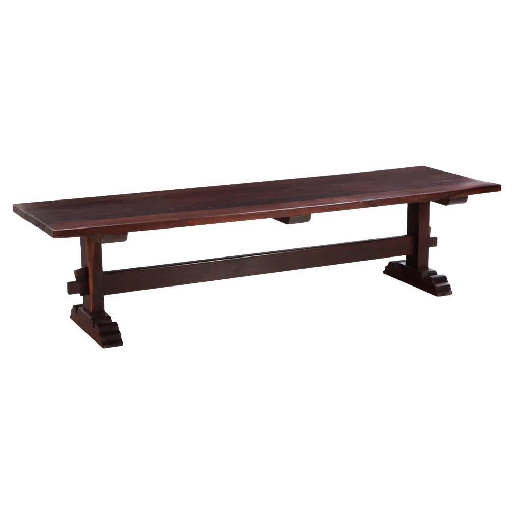 A Substantial Brazilian Trestle Table, C. 1920, made from a dense wood. For Sale