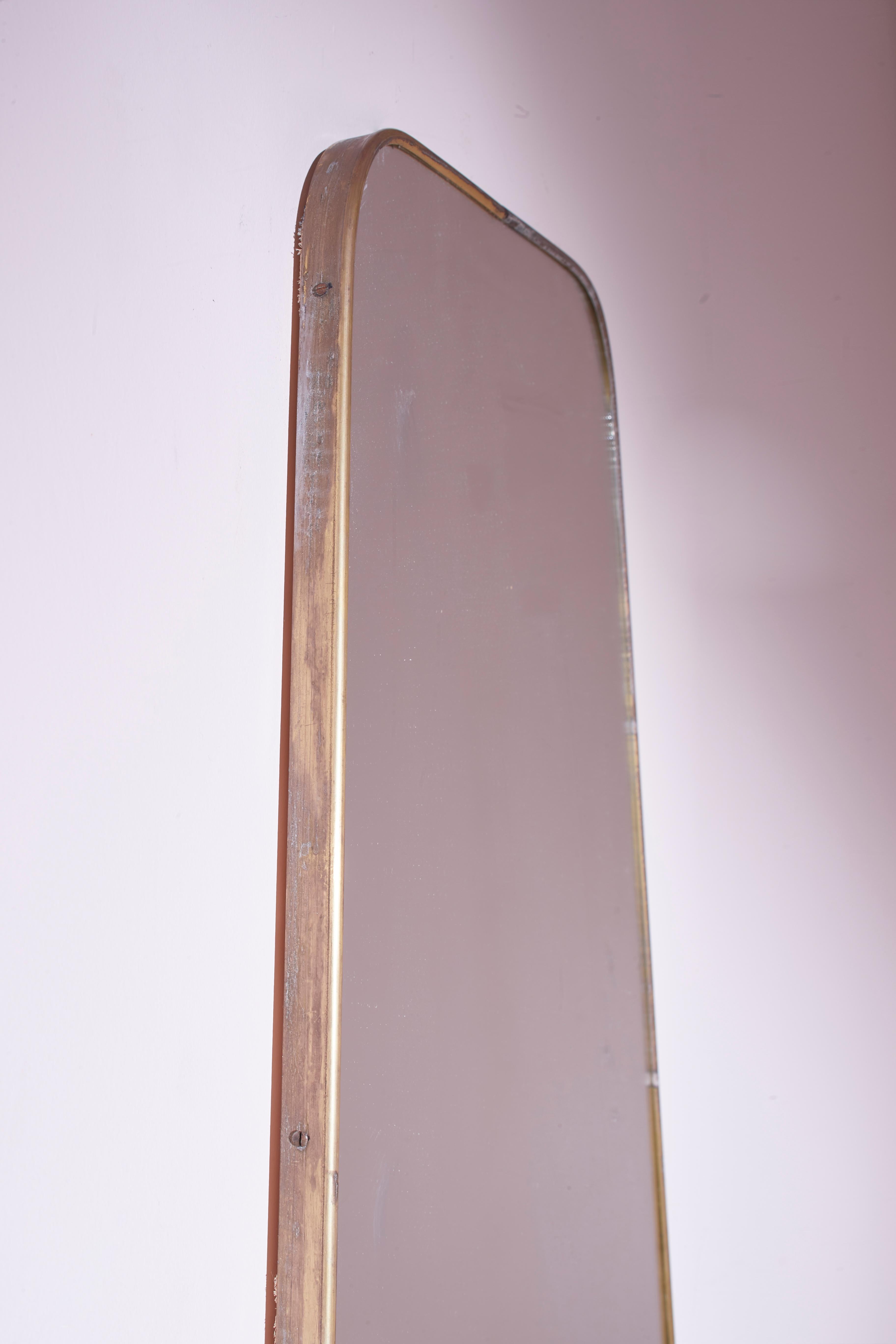 Mid-20th Century A substantial midcentury modernist wall mirror with brass frame, Italy, 1950s For Sale