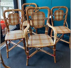 A Suite of (8) Exceptional Perret et Vibert Rattan Chairs