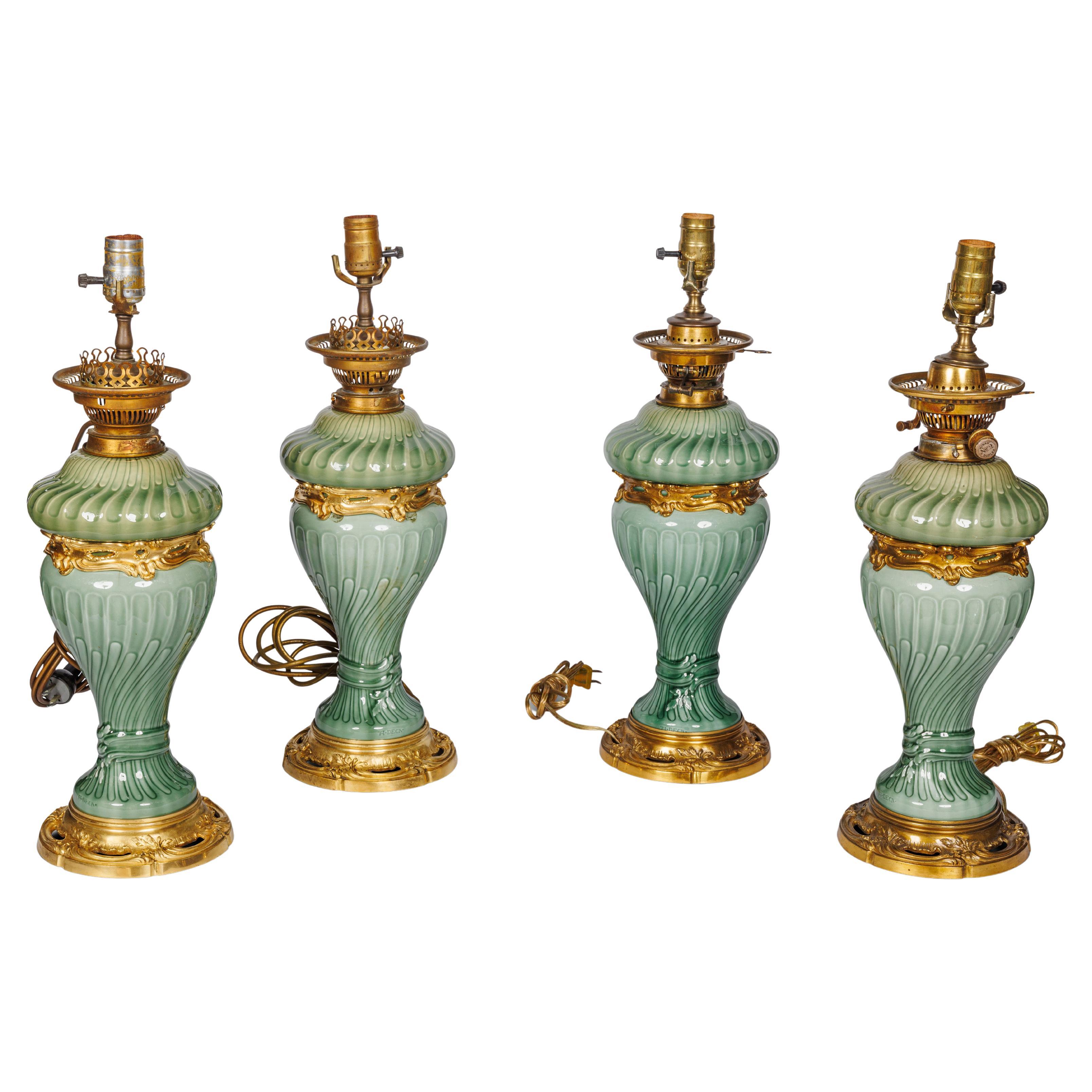 Una suite di quattro lampade in porcellana verde celeste con montatura in ormù di Theodore Deck