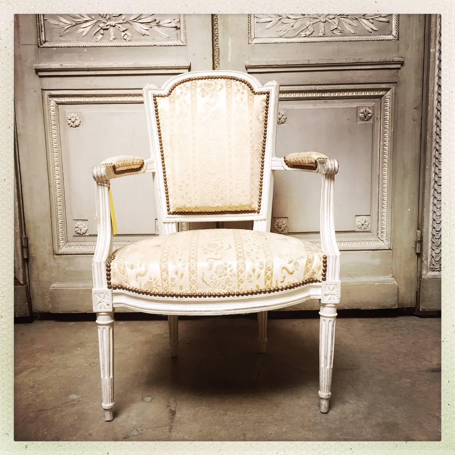 A set of six period French Louis XVI armchairs with a painted finish.
