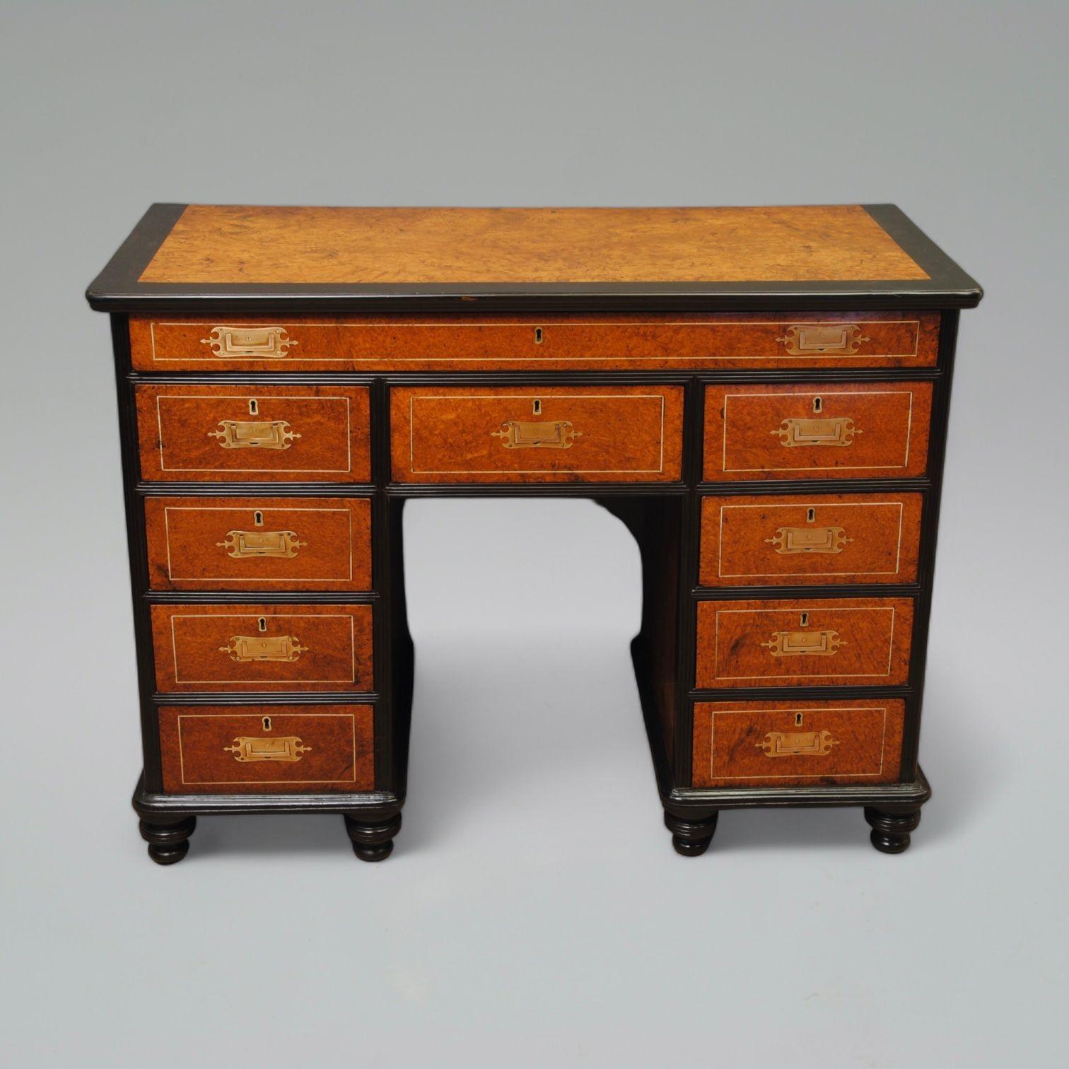 An early 19th century Chinese export campaign desk with fine fitted brass handles and reeded ebony around the well figured amboyna drawer fronts and top. The long slim top drawer with fitted writing slope Circa 1820
These fine quality pieces were