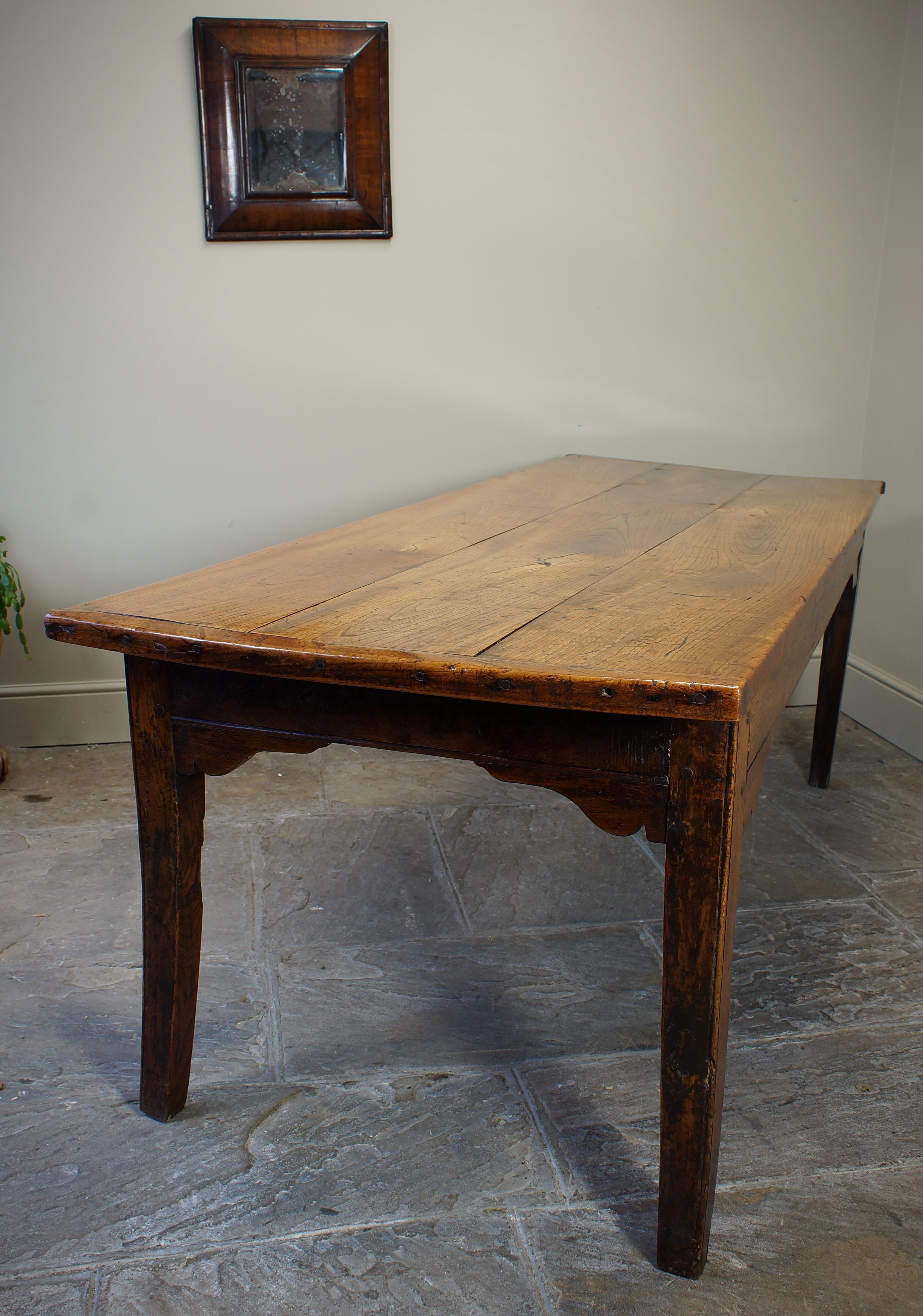 A fantastic example of an English or Welsh farmhouse table of a stunning colour and patina.
Having a three piece cleated top, four tapering legs, edge moulded rails and well shaped brackets.
The Elm boards have moved and twisted over the years but
