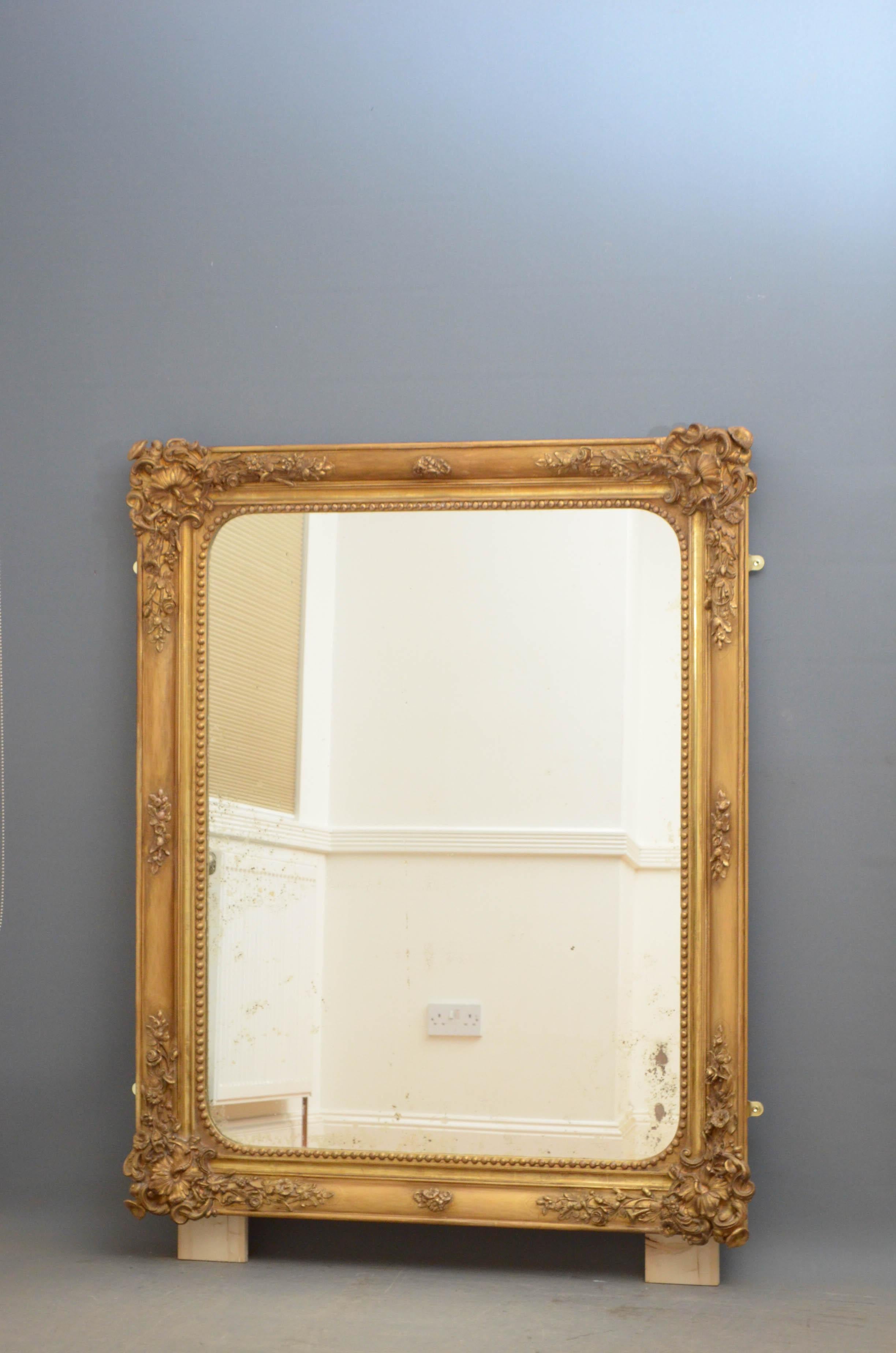 Sn4806 a large gilded wall mirror of versatile form, can be positioned portrait or horizontal way, with original foxed glass in beaded, moulded and floral decorated frame, all in excellent original condition throughout, circa 1860.
  