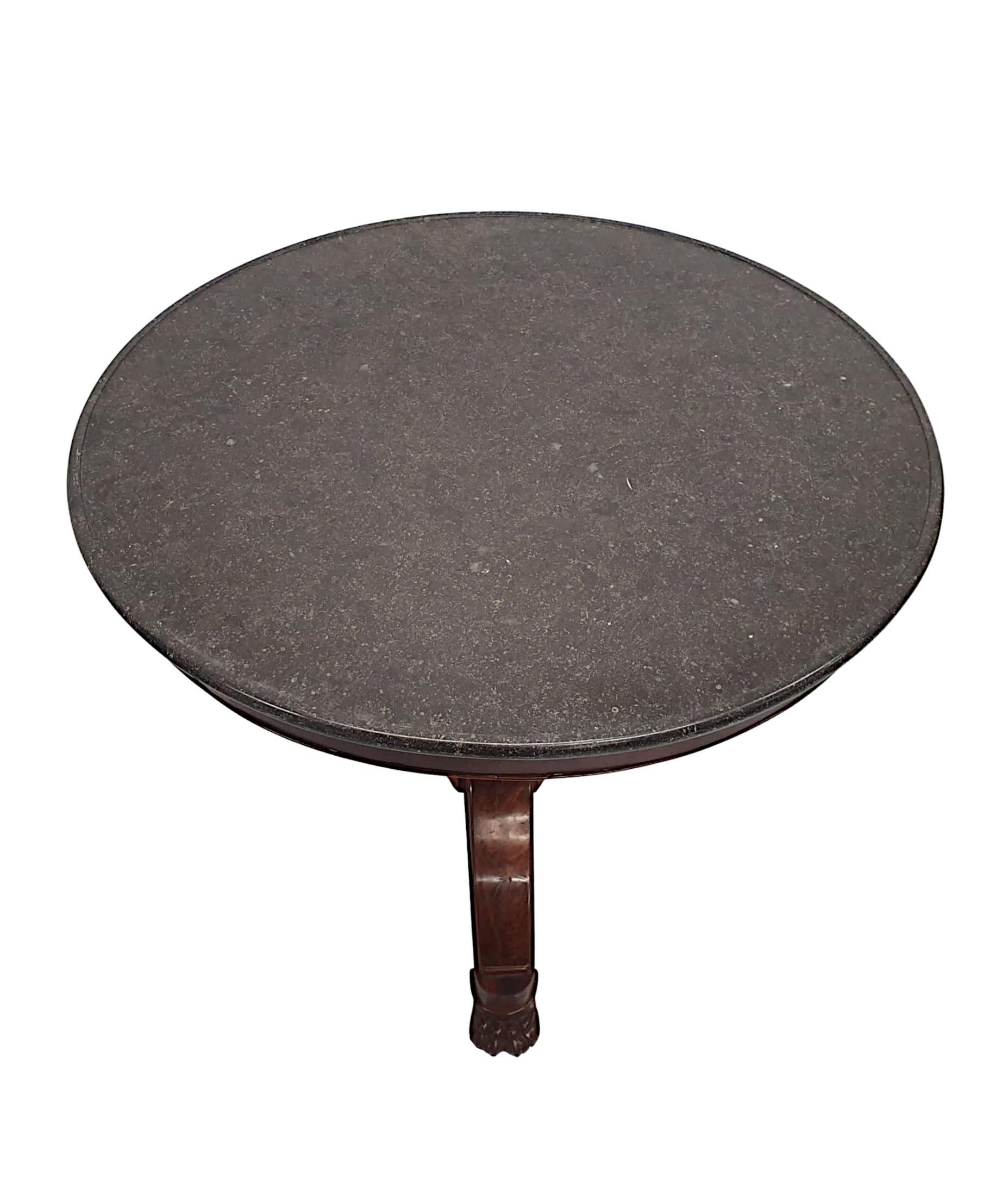 A superb 19th century mahogany marble top centre table, finely hand carved and of fabulous quality with rich patination and grain. The fabulous moulded emperador marble top of circular form is raised over a beautifully simple frieze, supported on